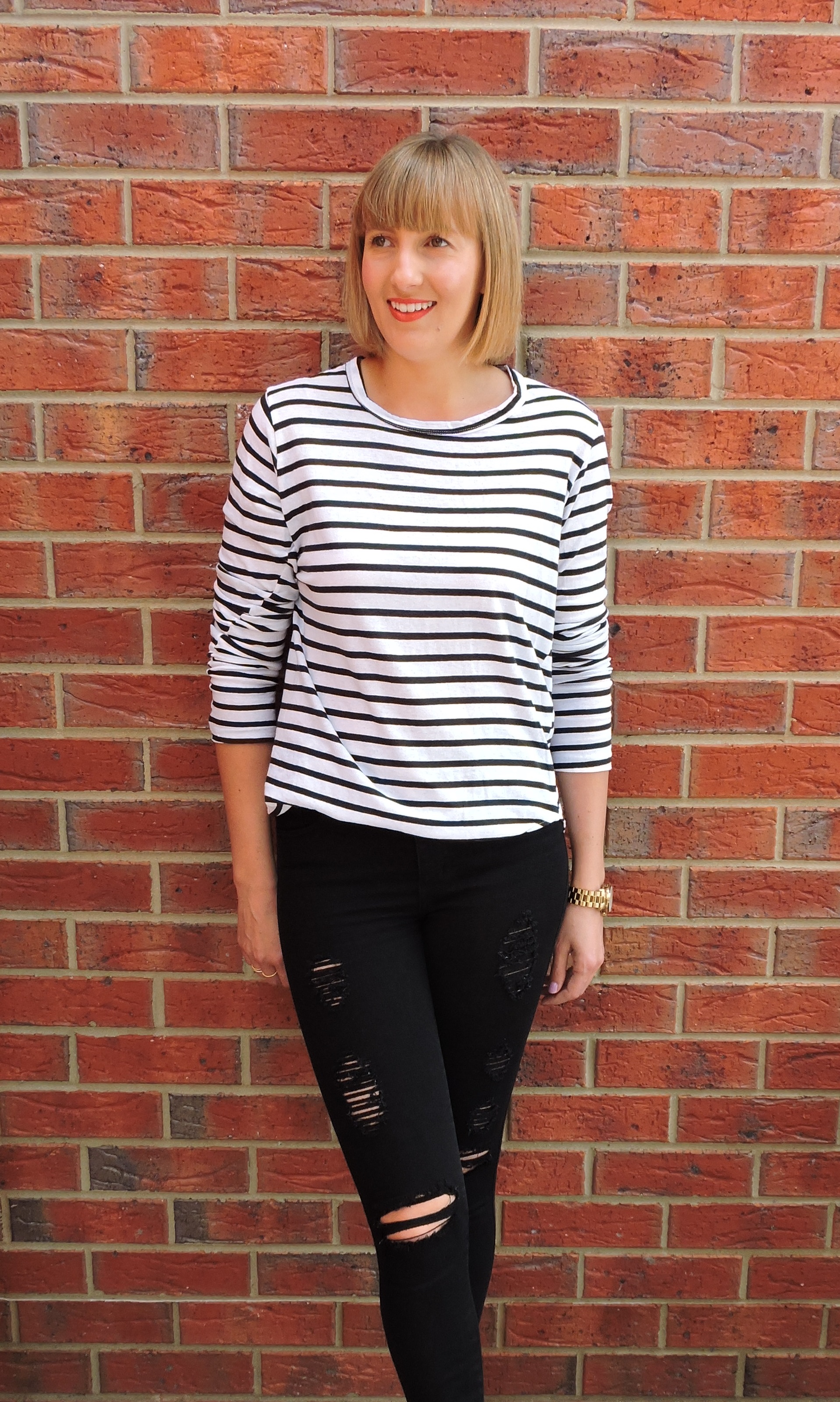 Bottoms by Nobody Denim Cult Skinny Ankle in ‘Bowie’, Bassike stripe heritage scoop hem long sleeve t-shirt and Bite Beauty Matte Crème Lip Crayon in ‘Blood Orange’. Photo credit: @steffpoort