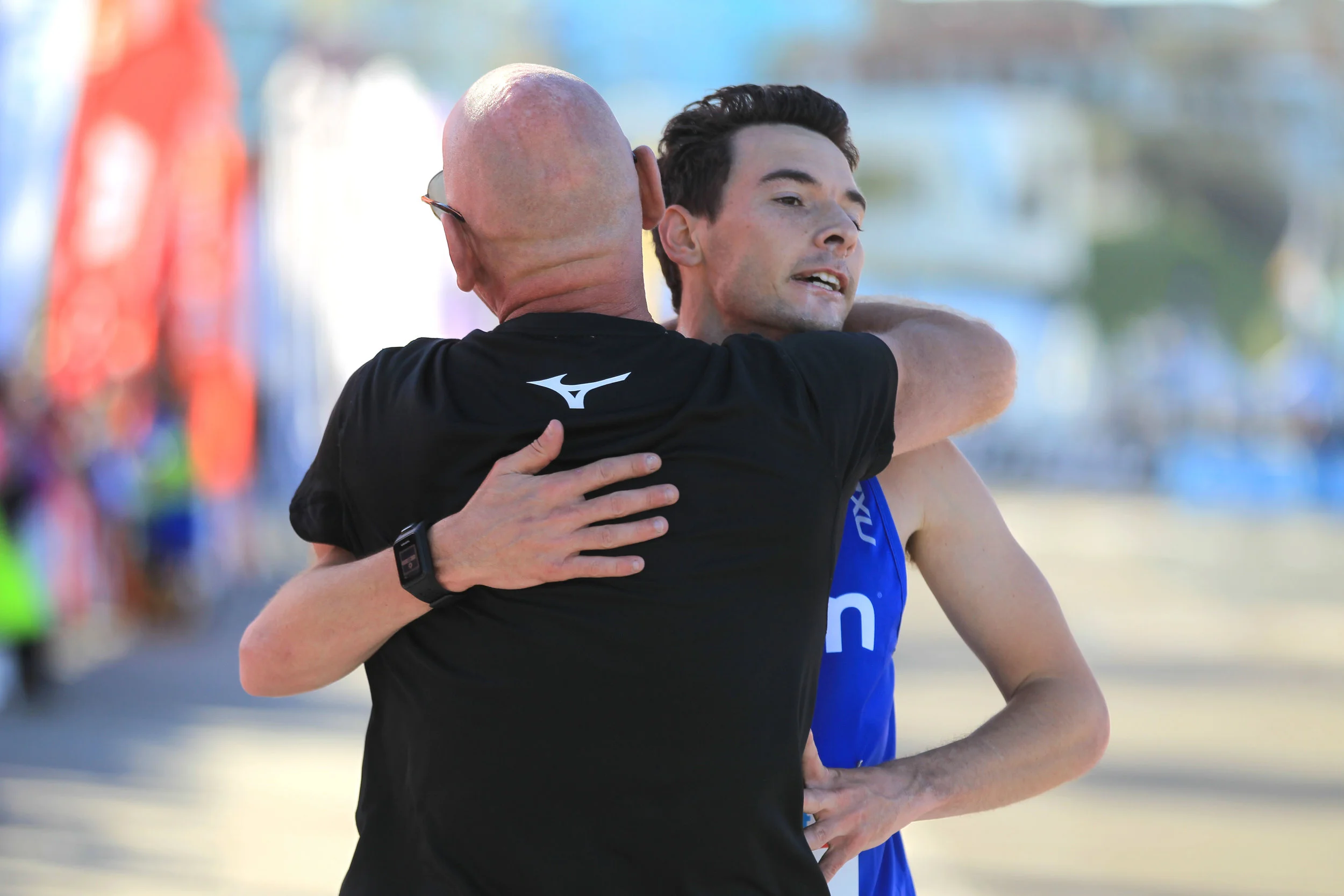 Jim and Harry hugging it out after Harry won City2Surf in 2017.