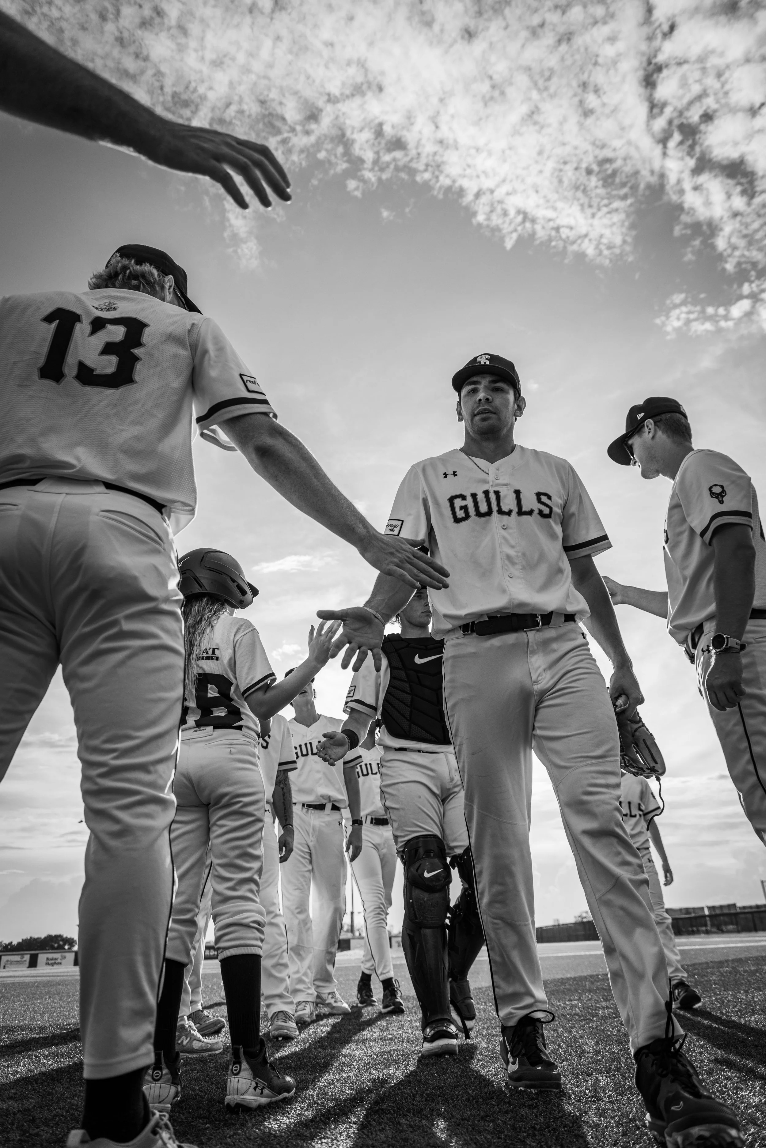 Sylvan Lake Gulls players high-five by Red Deer Alberta Sports and event photographer
