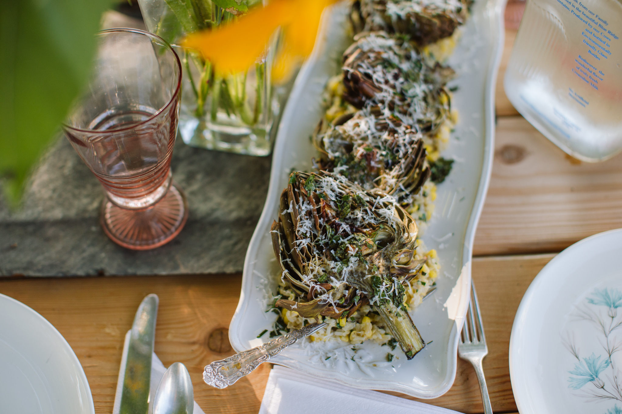 Roasted Artichokes on a bed of Spring Onion and Corn Salad