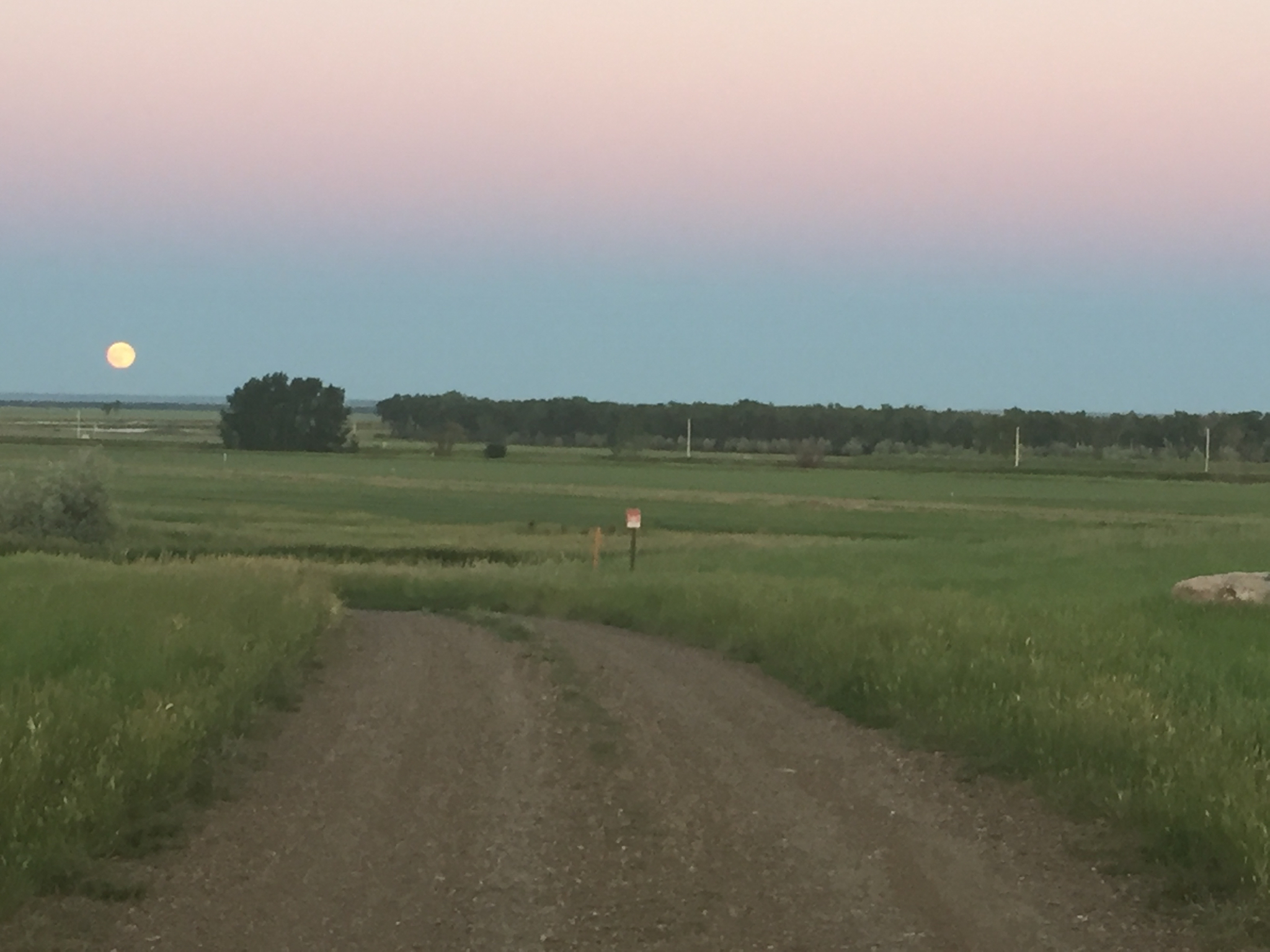 Full moon rising as sun is setting