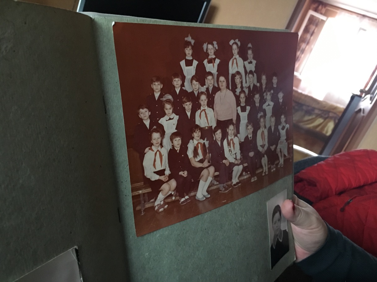 Anna Kireeva shows one of her class photos from the Soviet era.