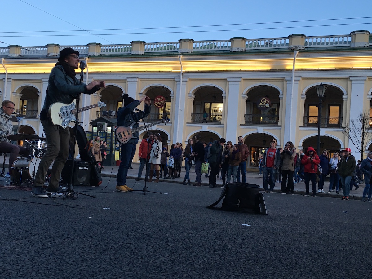 Musicians perform in the street.
