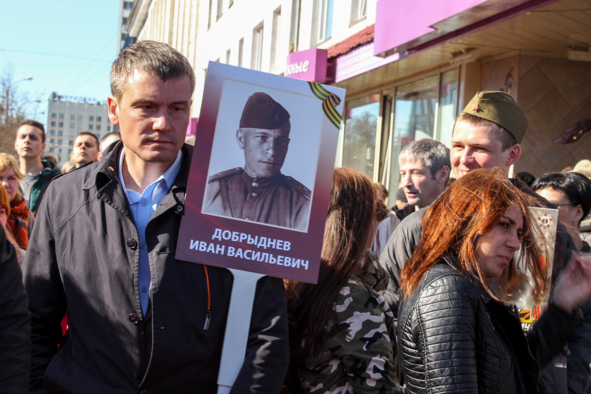 People march in the Victory Day parade, a celebration of the end of World War II, known as The Great Patriotic War here.