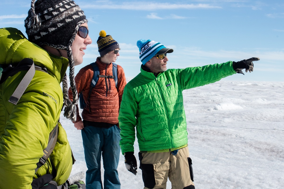 Graduate student Ian MacDowell, undergrad Aidan Stansberry, and principal investigator Joel Harper at work on the Greenland ice sheet
