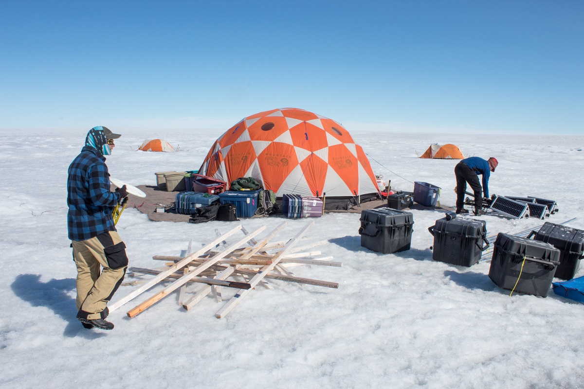 University of Montana glaciologists Joel Harper and Toby Meierbachtol assemble the gear they're using to measure the movement of the ice sheet.