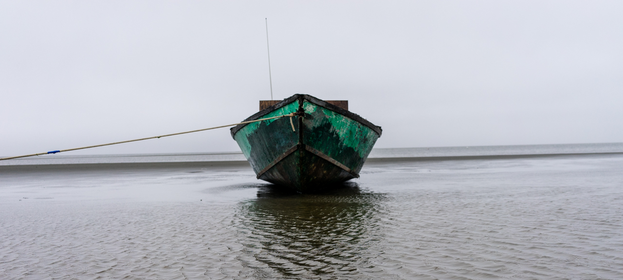 A boat floats off the coast of Shishmaref.