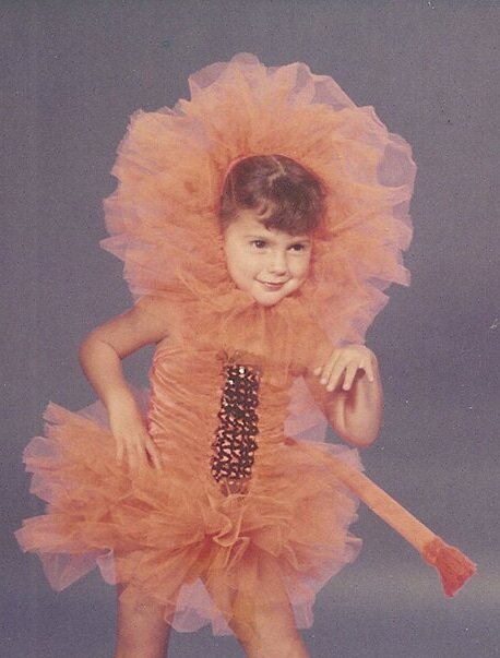 Young Ami Vitale in lion costume.