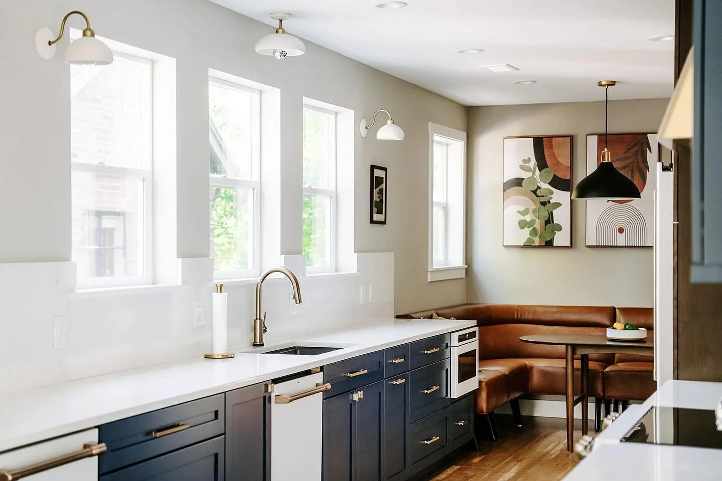 Let the light in. We opted for extra windows instead of upper cabinets in this galley style kitchen to keep things bright and airy. Anchored by the banquette seating for cozy family breakfast, we think this kitchen has all the right vibes.