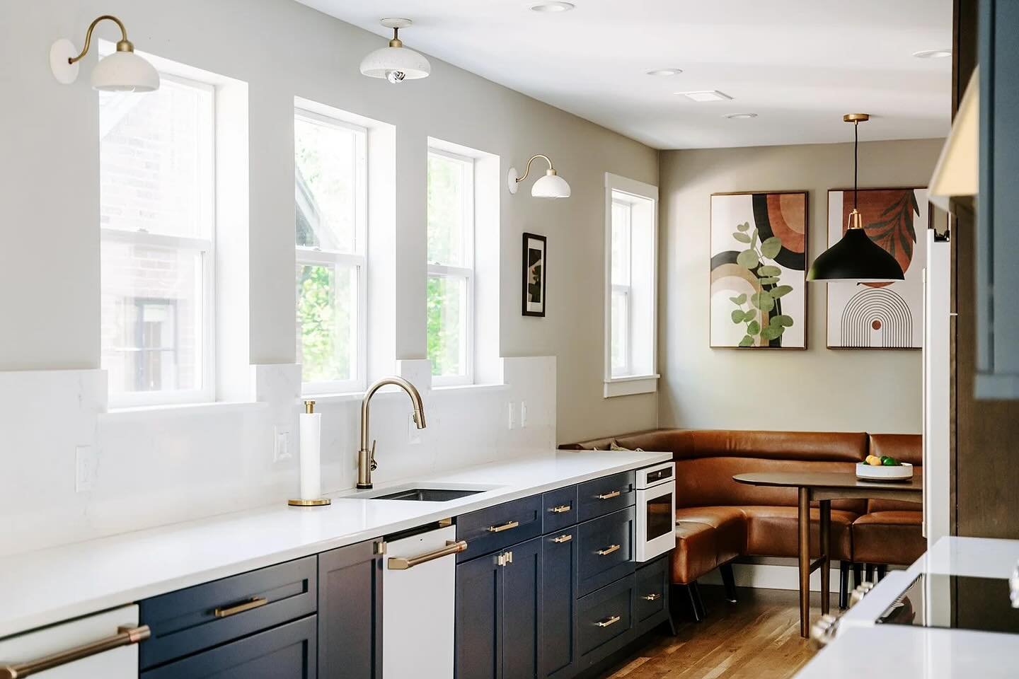 Let the light in. We opted for extra windows instead of upper cabinets in this galley style kitchen to keep things bright and airy. Anchored by the banquette seating for cozy family breakfast, we think this kitchen has all the right vibes.