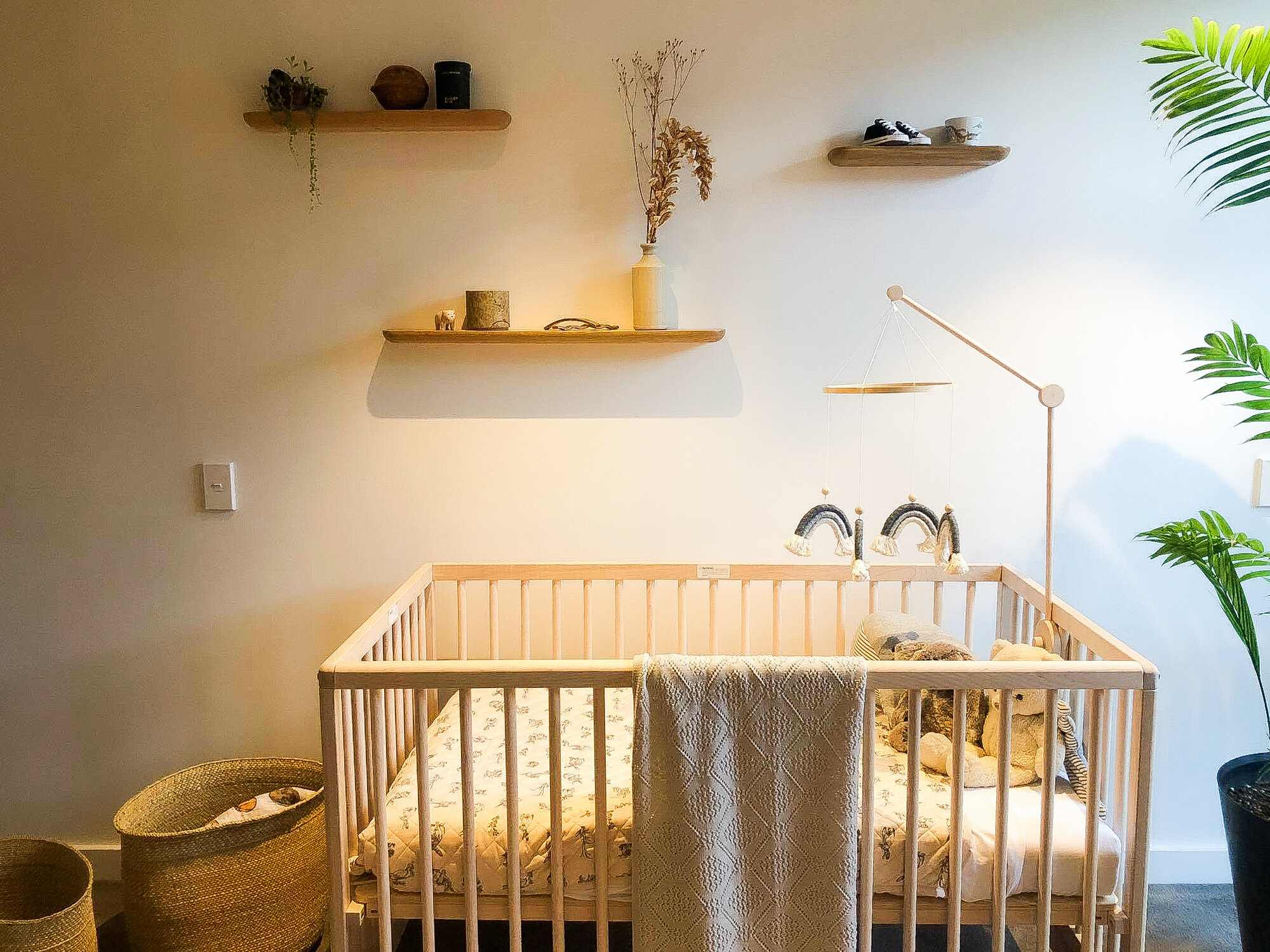 •Cot:  Nature Baby  •Cot Arm:  Cot and Cot  •Rabbit Print Cot Blanket:  Dapper Mr Bear  •Merino Heirloom Blanket:  Tessuti  • Floating Shelving:  Citta Design  •Handmade Rainbow Mobile:  Ash &amp; Co