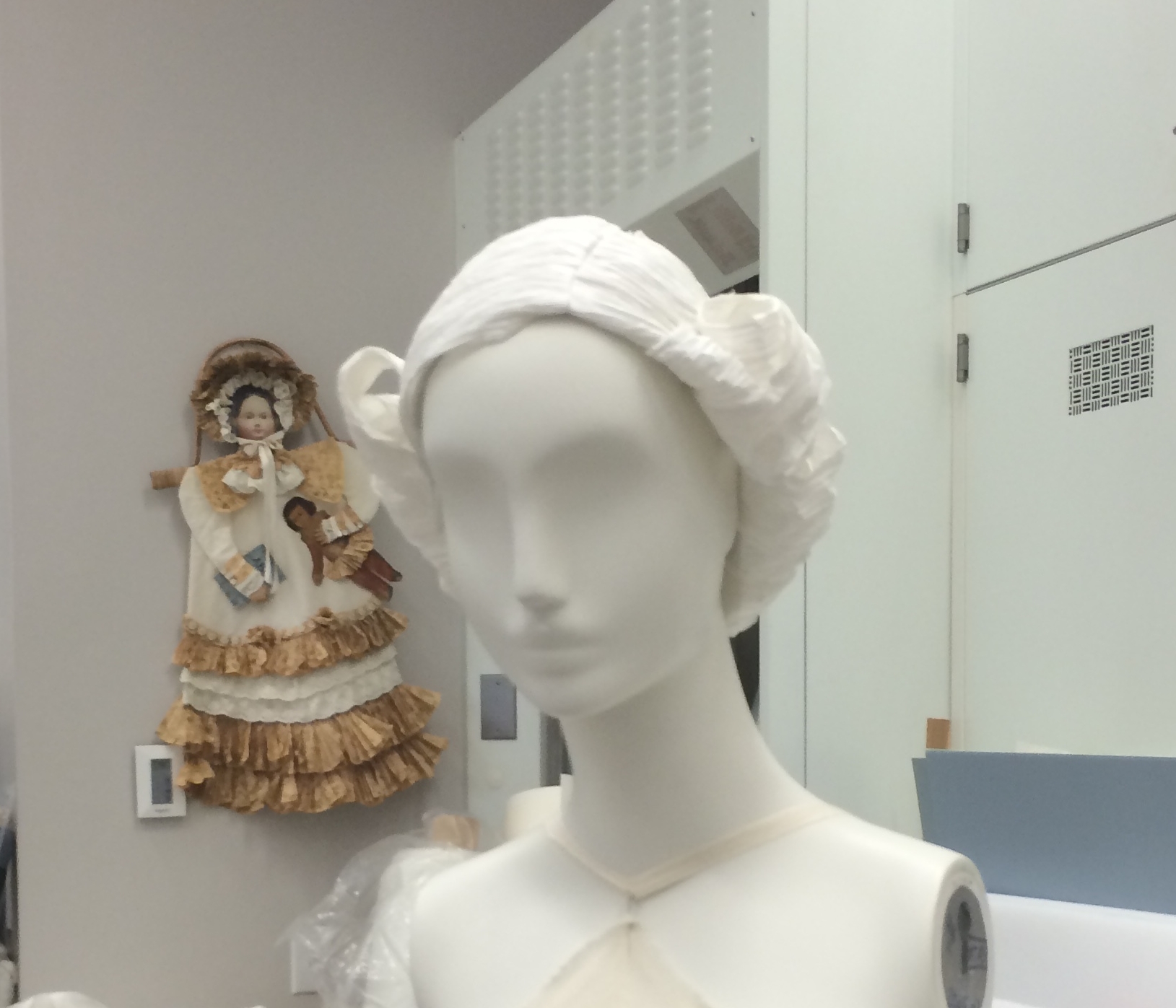  The museum had custom paper wigs created for each mannequin. Each one had a different hairstyle contemporary to the dress it was paired with. They were very elaborate! 