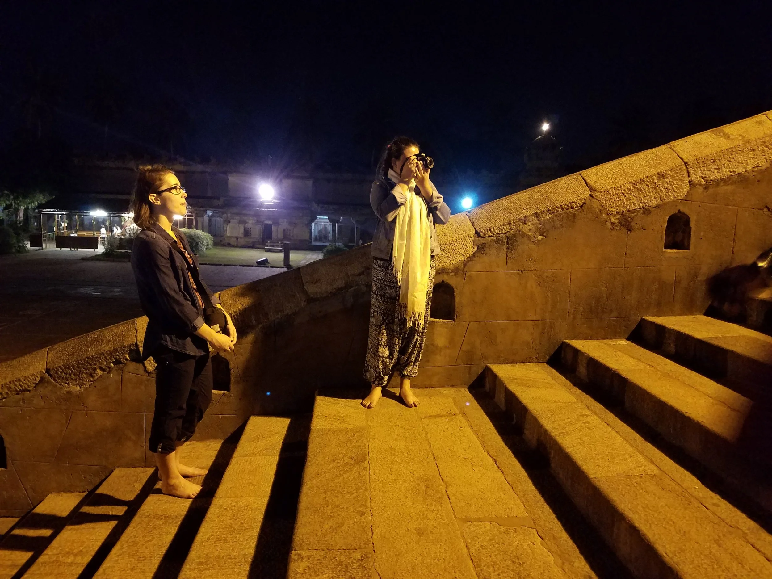 Chloe and Laura wait for the last procession, Thanjavur.
