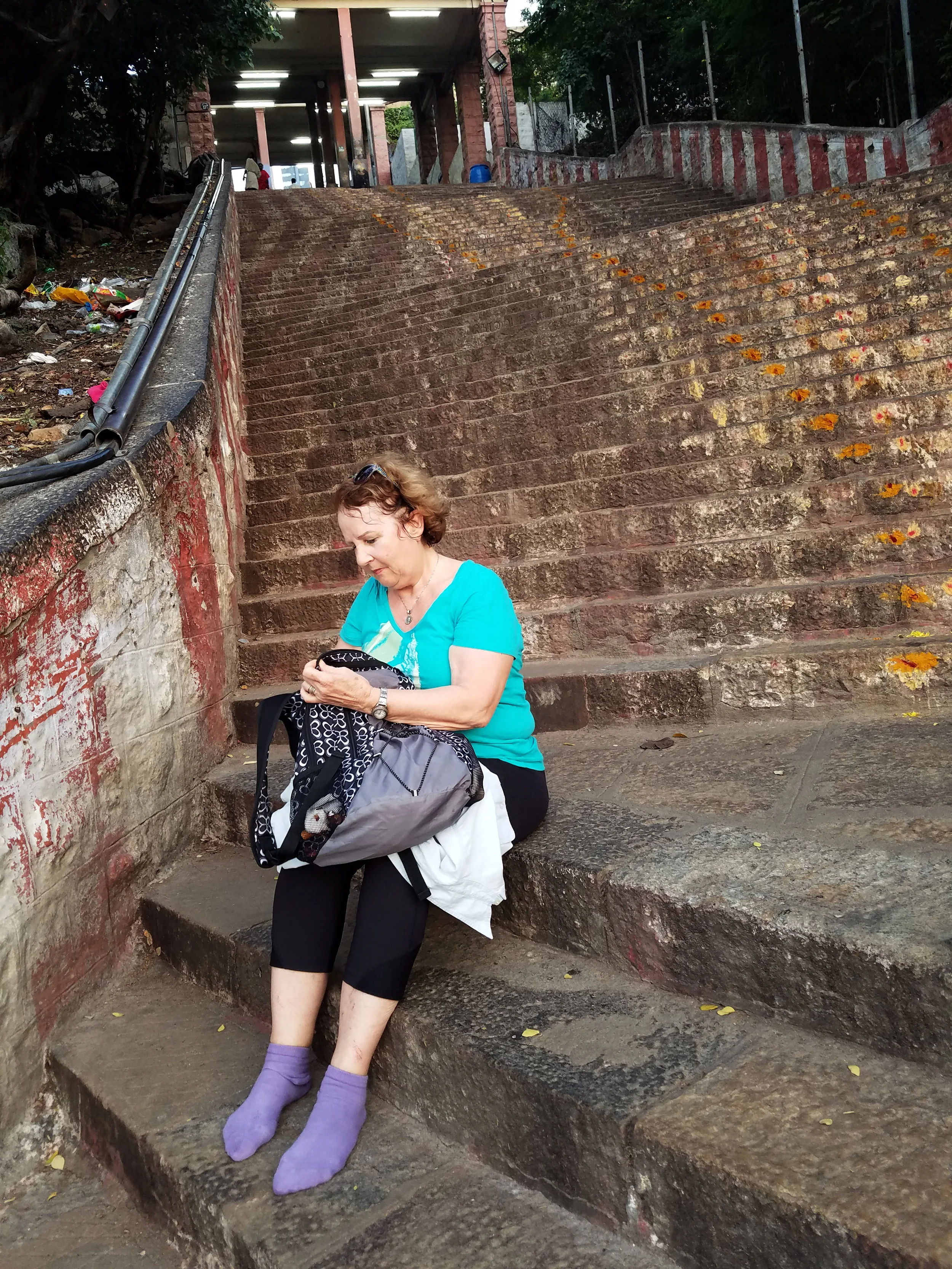 Pat's purple socks are a first for the steps of Palani temple.