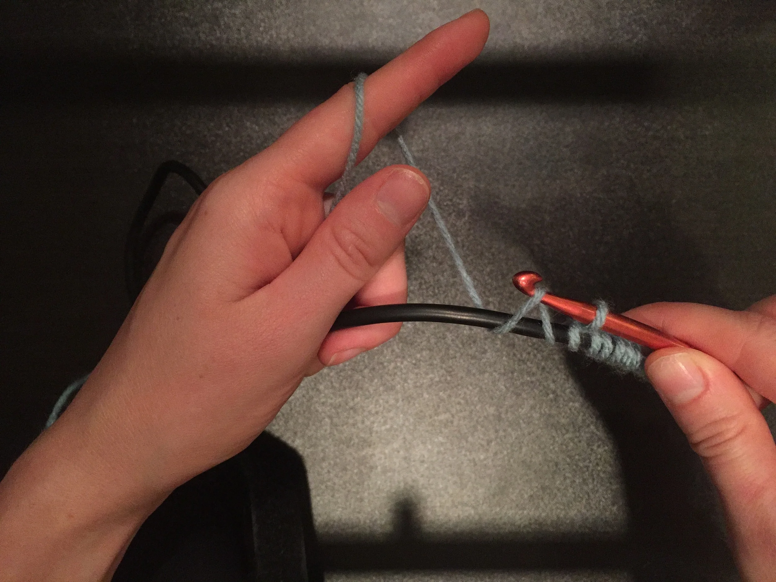 Pull the yarn to the front so that you have two loops on your needle.