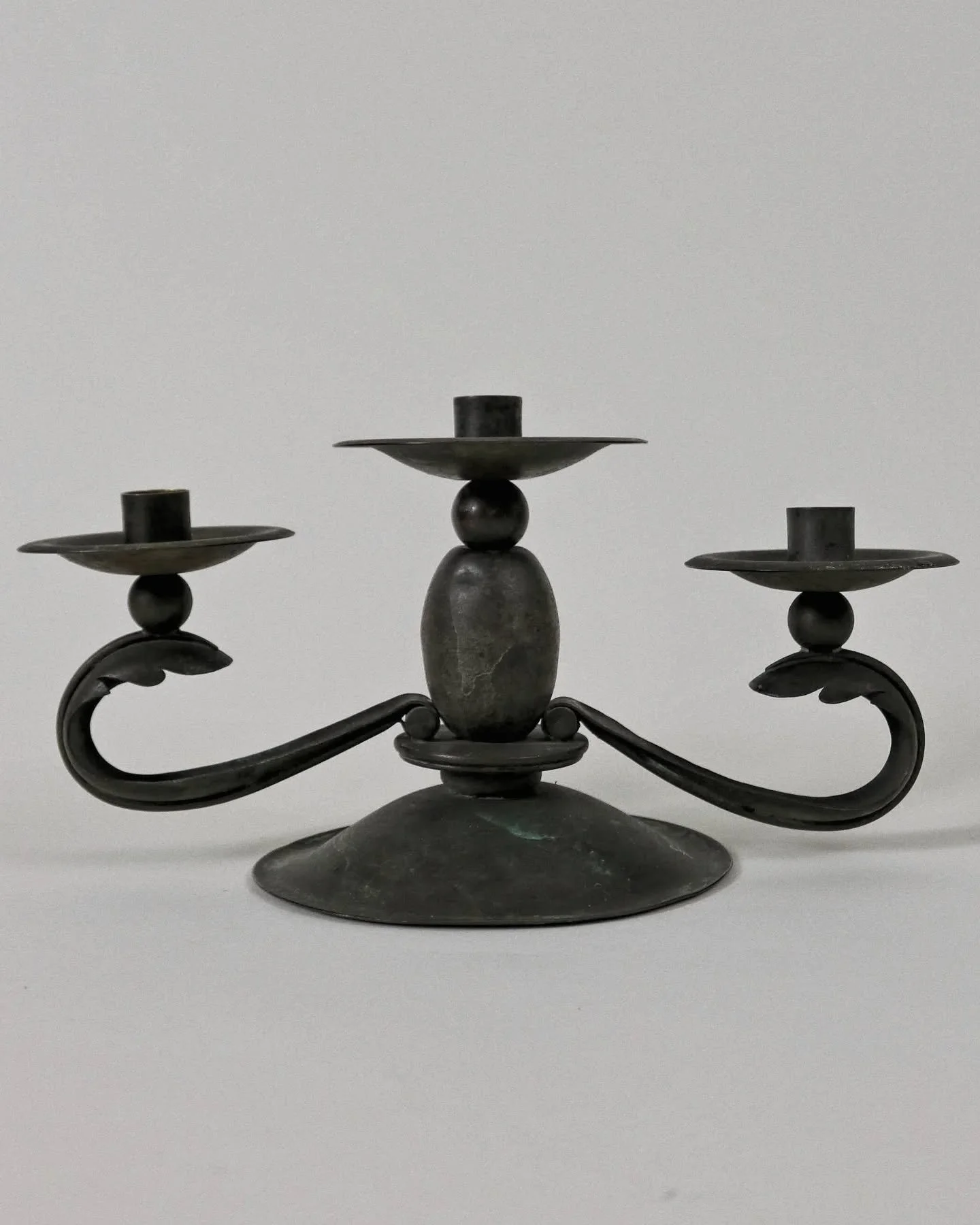 A large patinated candlestick from 1930's Germany.

Available online.