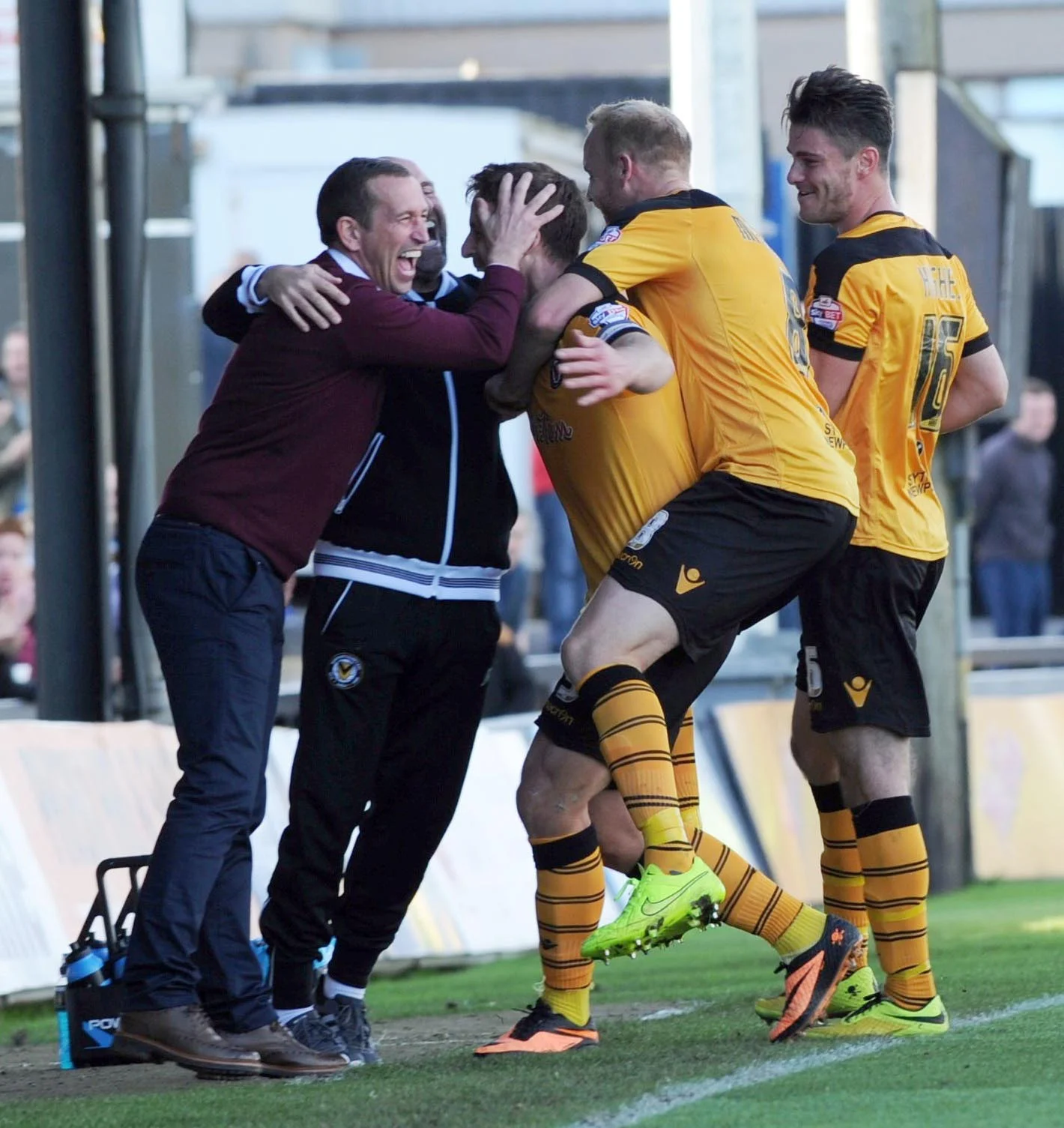 Newport County manager Justin Edinburgh celebrates a goal with his players