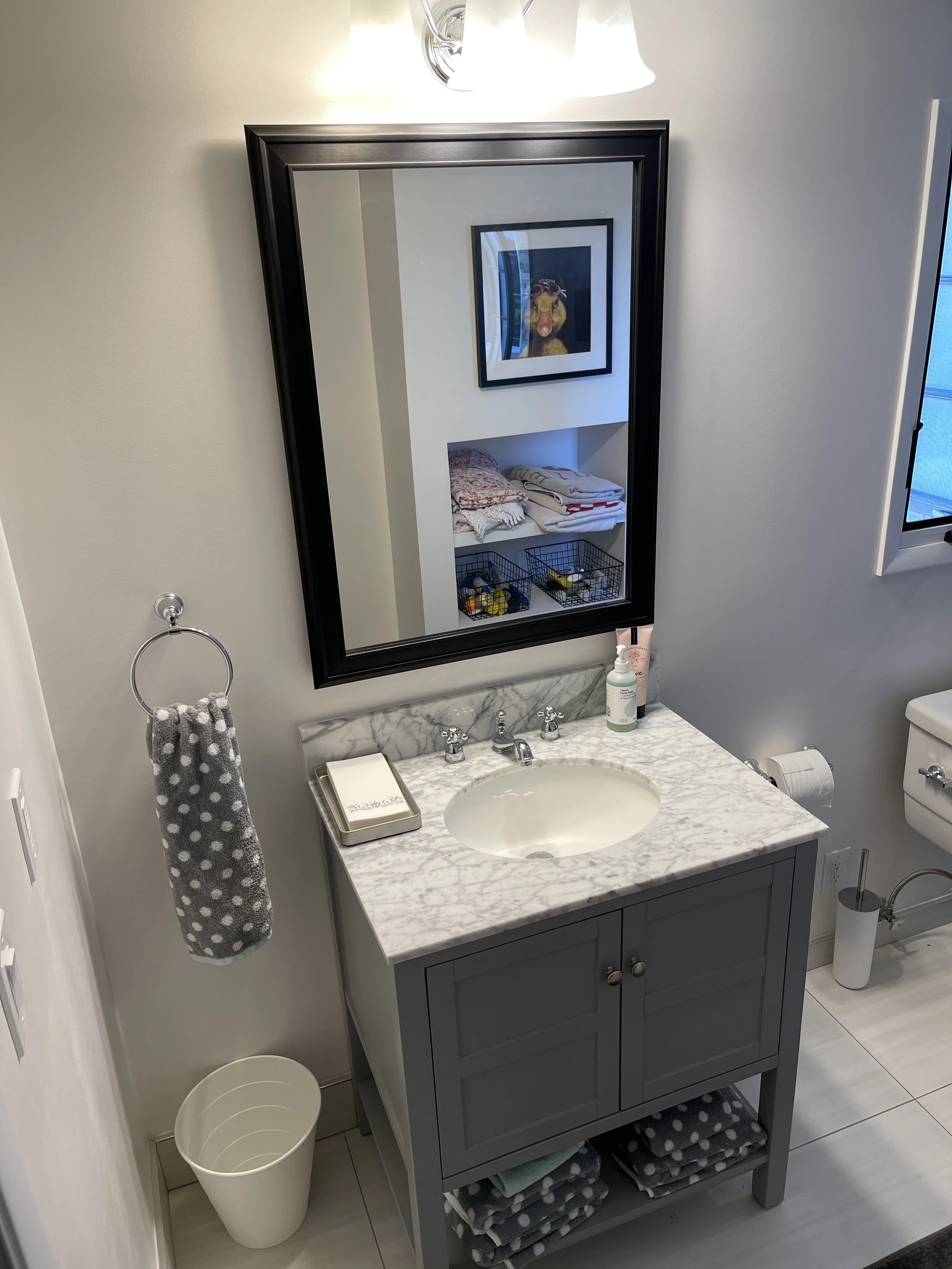  A simple off-the-shelf vanity and a custom built towel niche creates a fun and functional space 