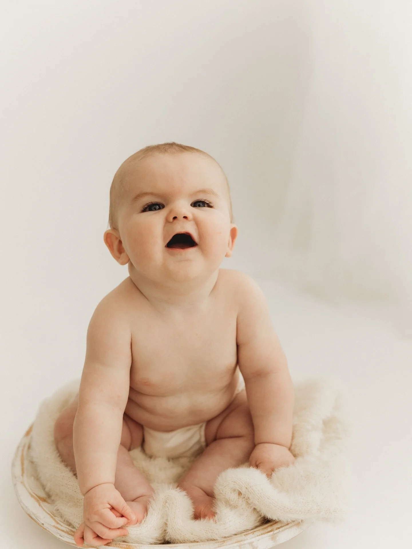 One of my favorite parts of what I do is watching these little babies grow from their newborn session into this stage full of tiny toes, gummy smiles, and so much personality

www.annadanielsphotography.com