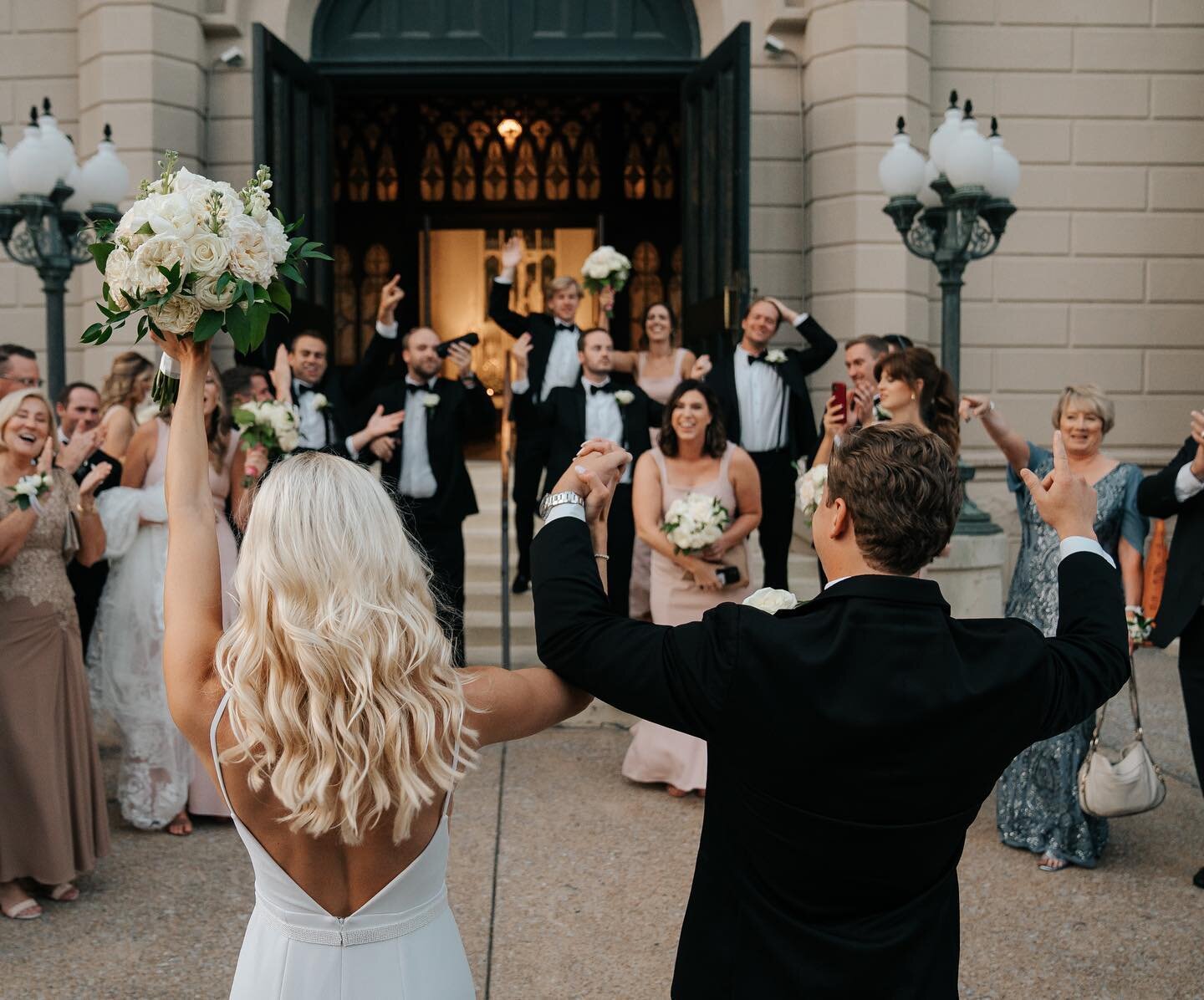 One of my absolute favorite moments from Whitney and Riley&rsquo;s wedding- these two, freshly married, surrounded with love and being celebrated by their closest friends and family on the steps of St. Peter&rsquo;s Catholic Church before heading to 