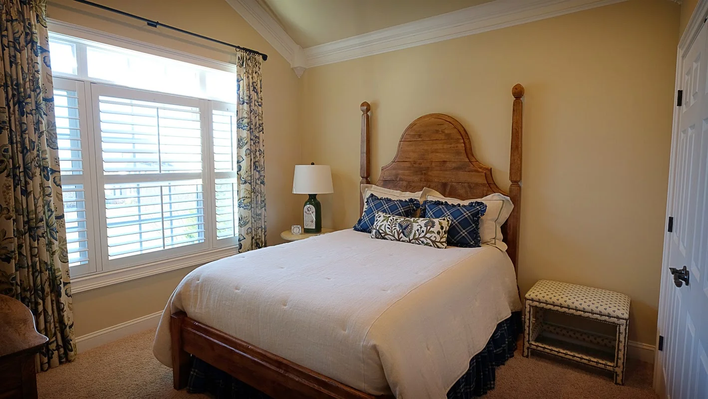 Light tan, taupe bedroom with vaulted ceilings and large window, white trim - Residential painting by Nash Painting Nashville TN