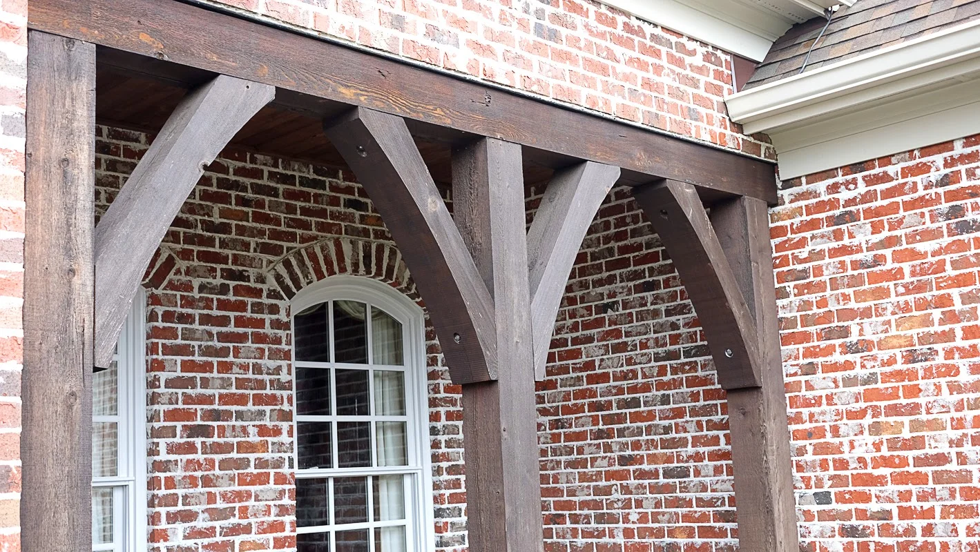 Exterior wood trim staining, front porch area on a brick home - Residential painting by Nash Painting Nashville TN