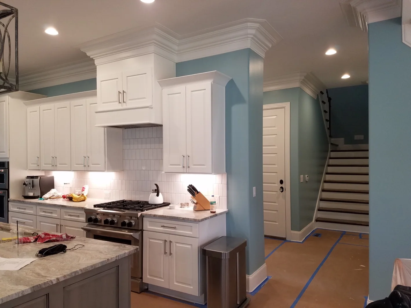 Blue kitchen with white cabinets - Residential painting by Nash Painting Nashville TN