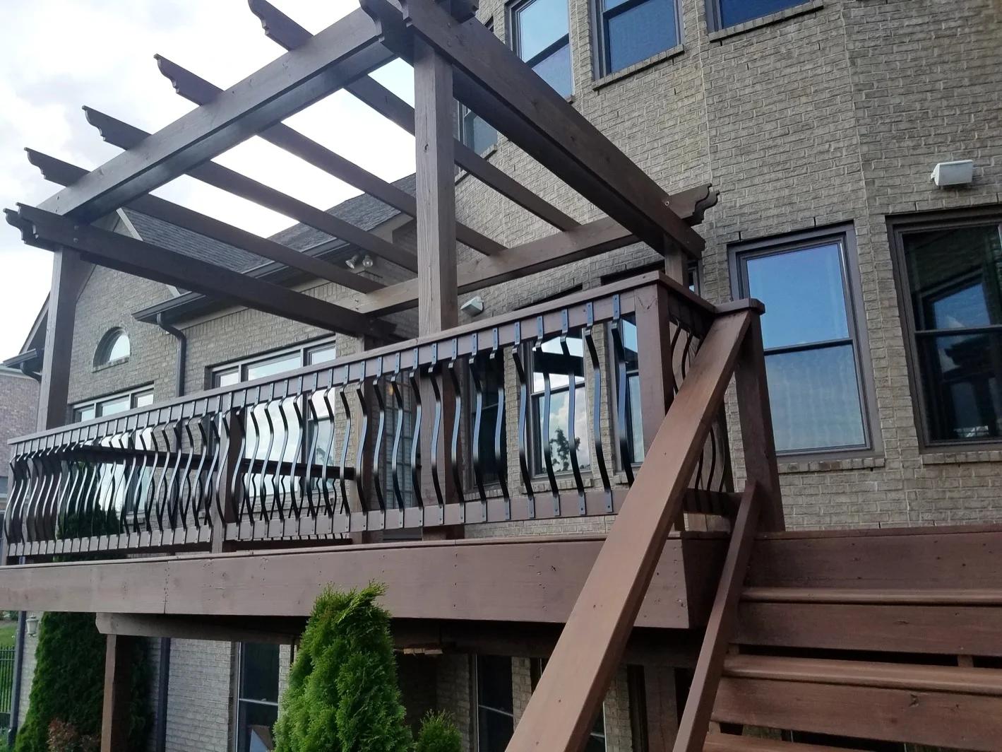 Exterior brown paint on porch and trellis - Residential painting by Nash Painting Nashville TN