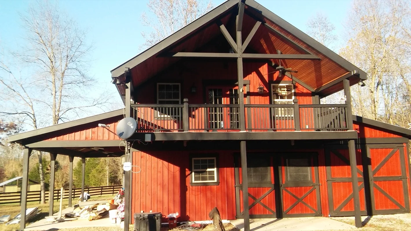 Exterior red and black paint on barn-style home - - Residential painting by Nash Painting Nashville TN