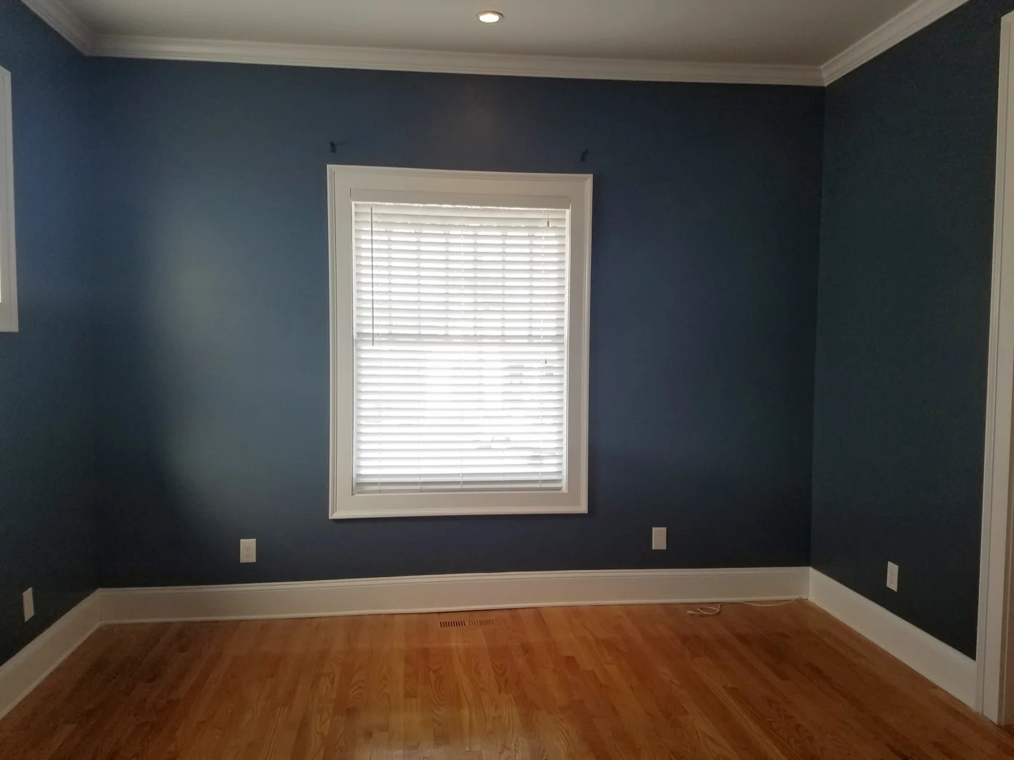 Dark blue room with wood floor - Residential painting by Nash Painting Nashville TN