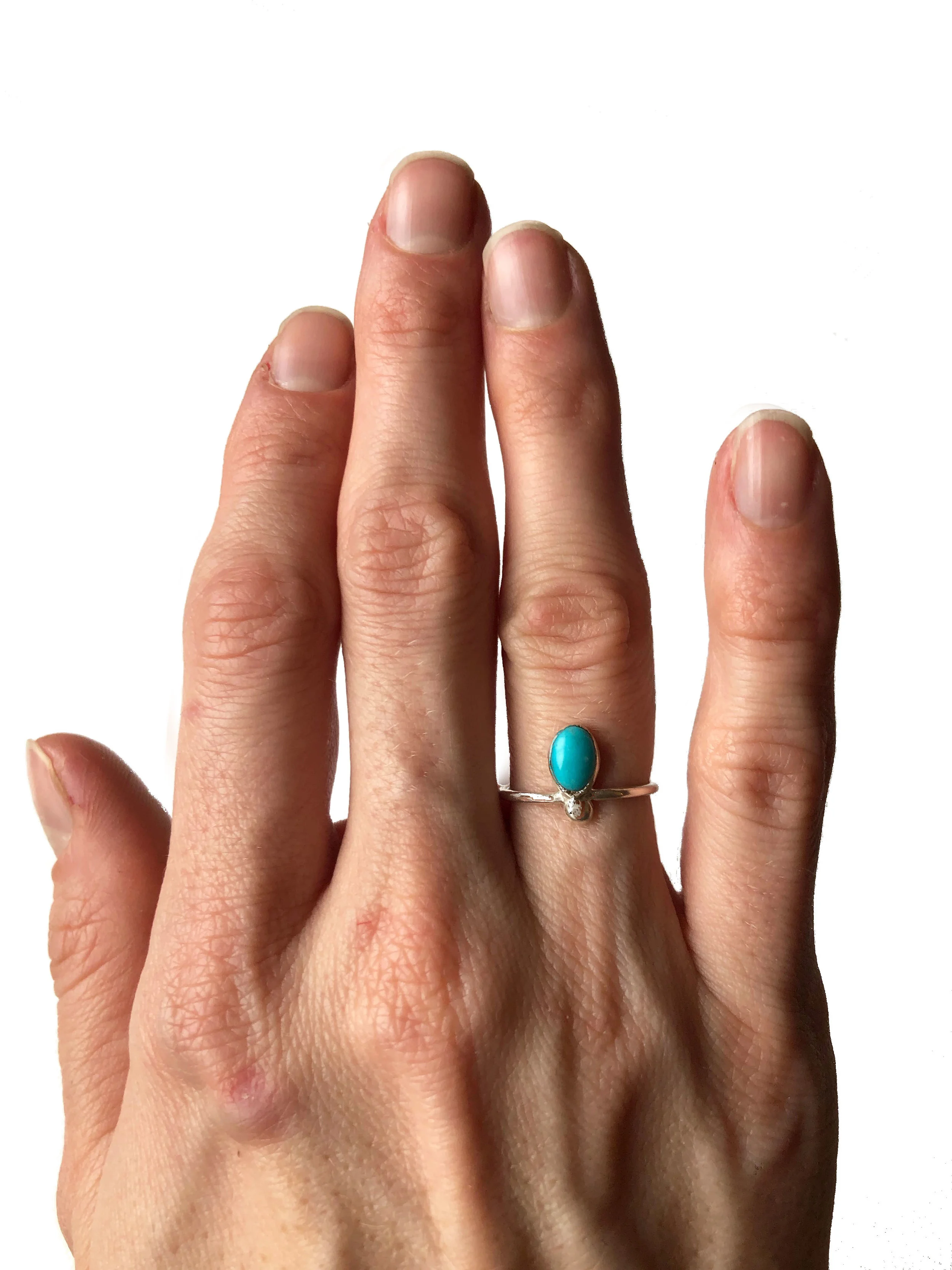 Tiny Turquoise Ring On Hand.jpg