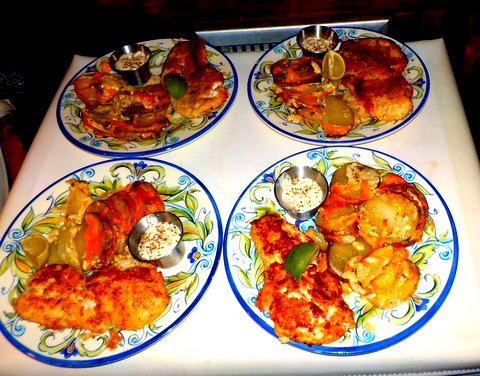 Fried fish with cheesy scalloped potatoes and caper sauce