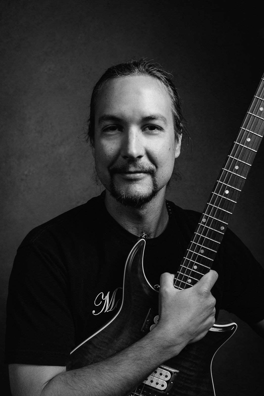 Professional guitarist Dan Haedicke providing private guitar instruction to a student in his Lakes Region, NH studio.