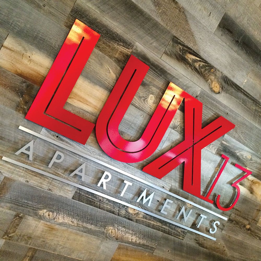 neutral7 design large format printing lux13 apartments lobby sign metal logo signage
