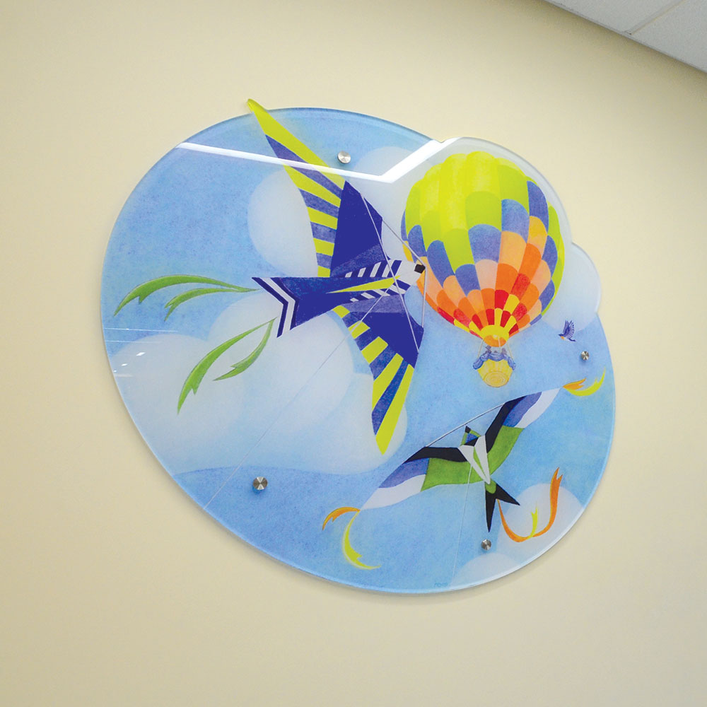 Custom acrylic wall signs with standoff hardware.