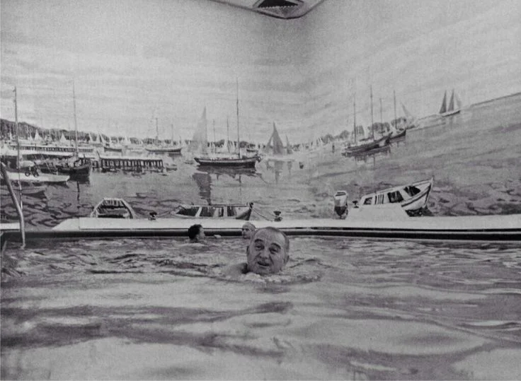 President Johnson swimming in the White House pool.