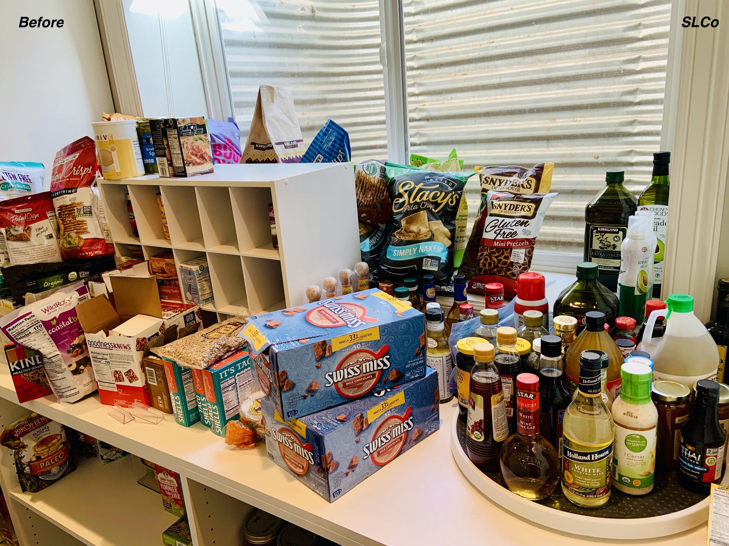 Large pantry counter with items stacked on top of each other