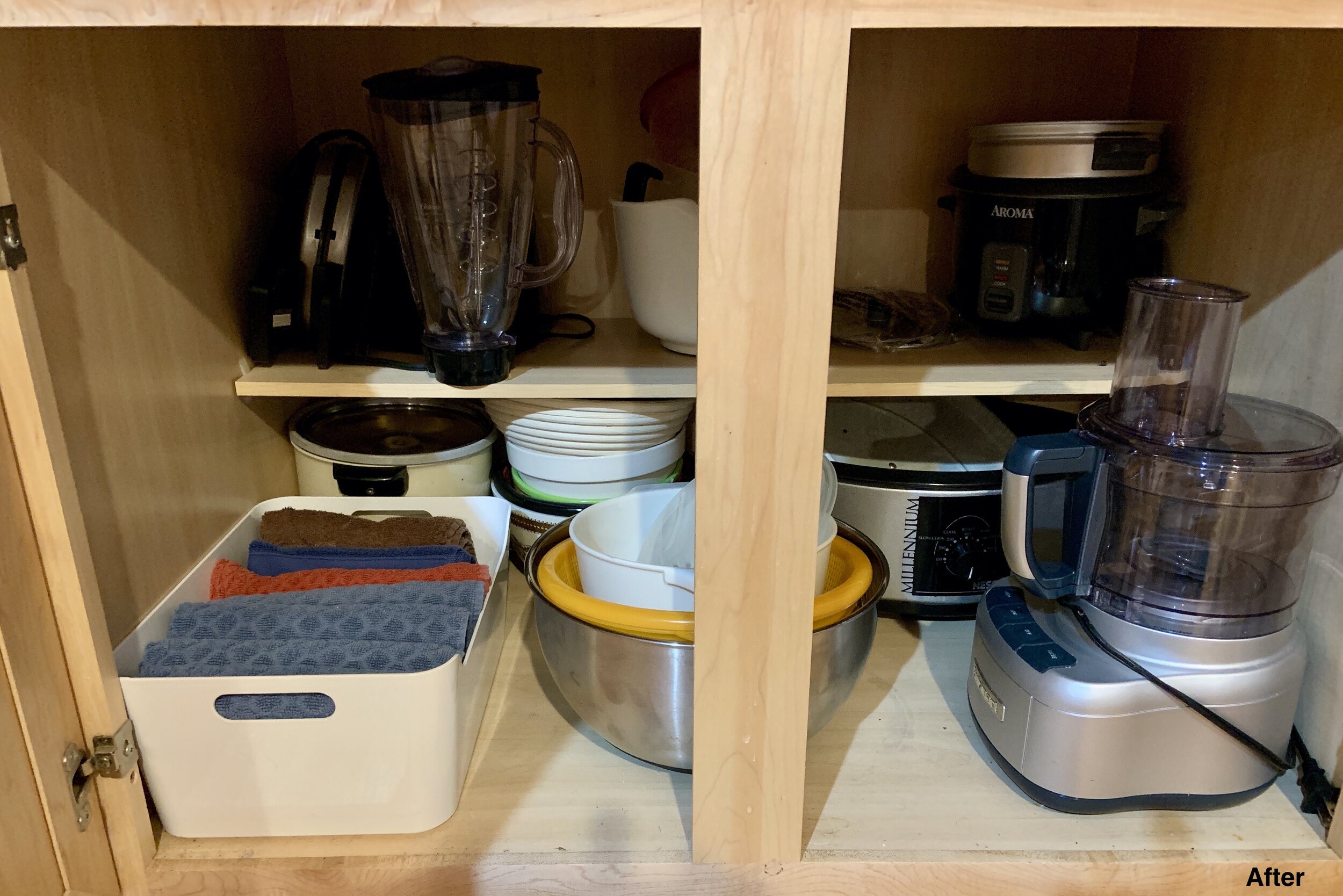 After photo of kitchen cabinet with blender, bowls, and lids organized.