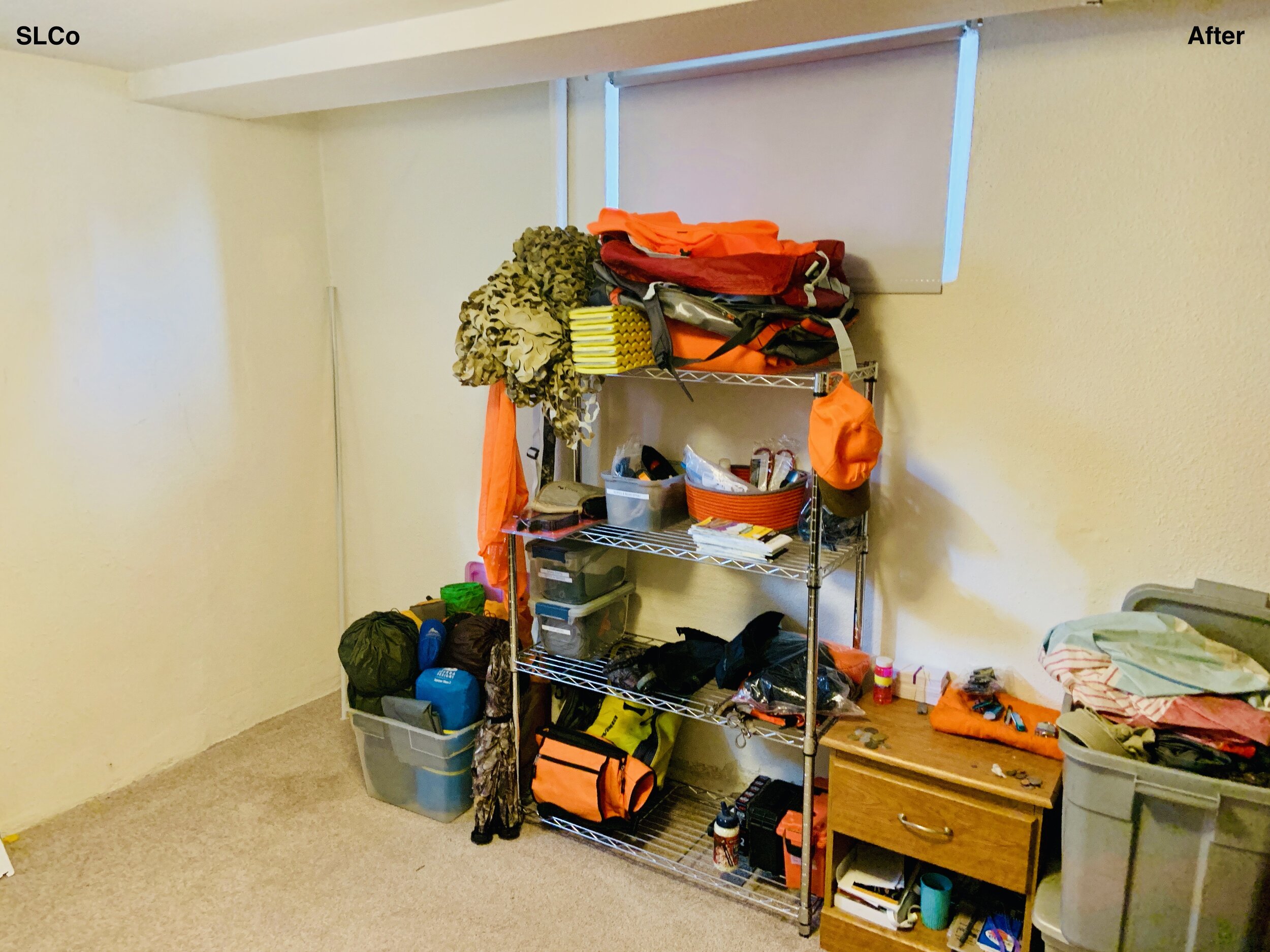 After photo of corner of a room with shelving unit with bags on it and floor cleared.