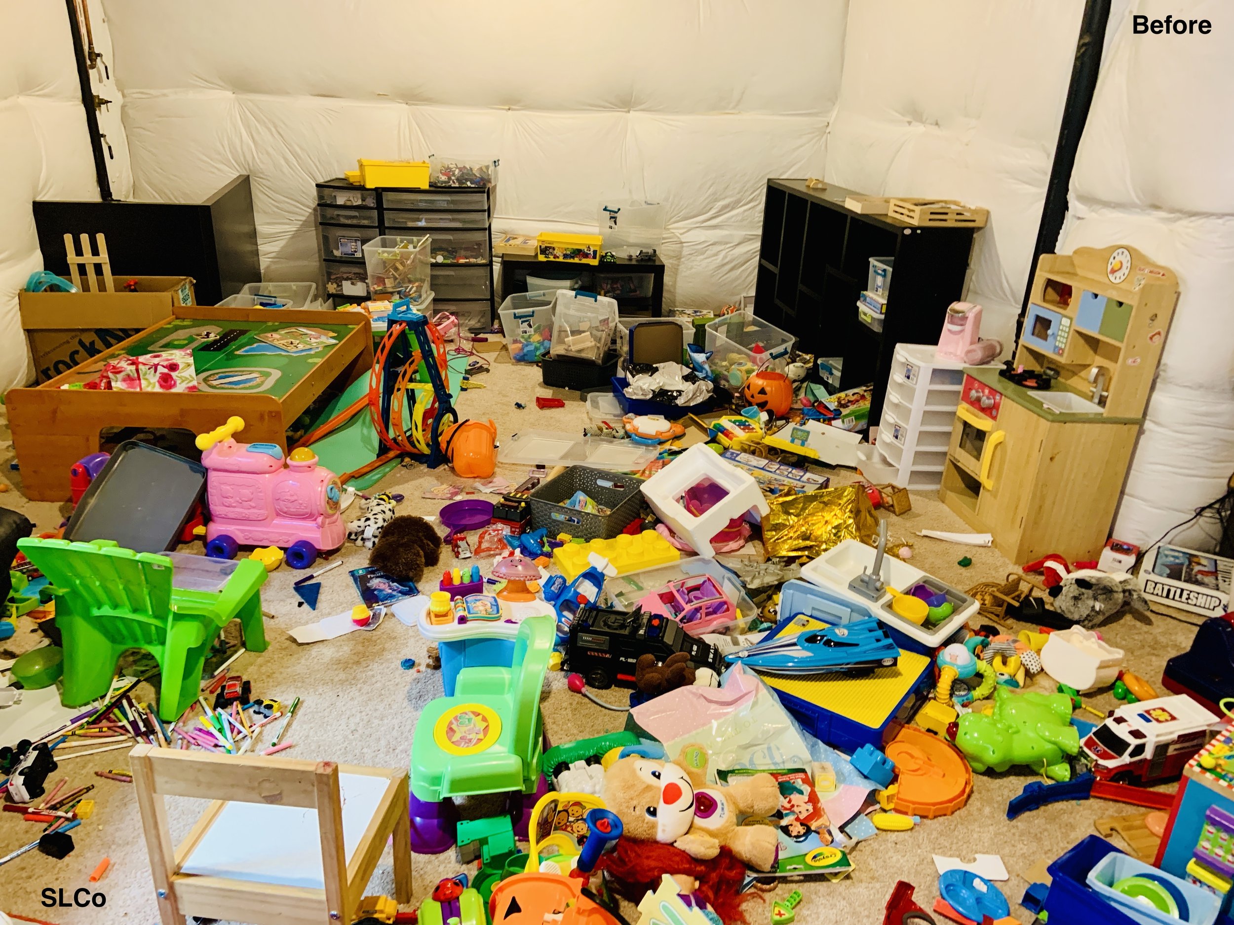 Playroom with children's toys all over the floor, unwalkable.