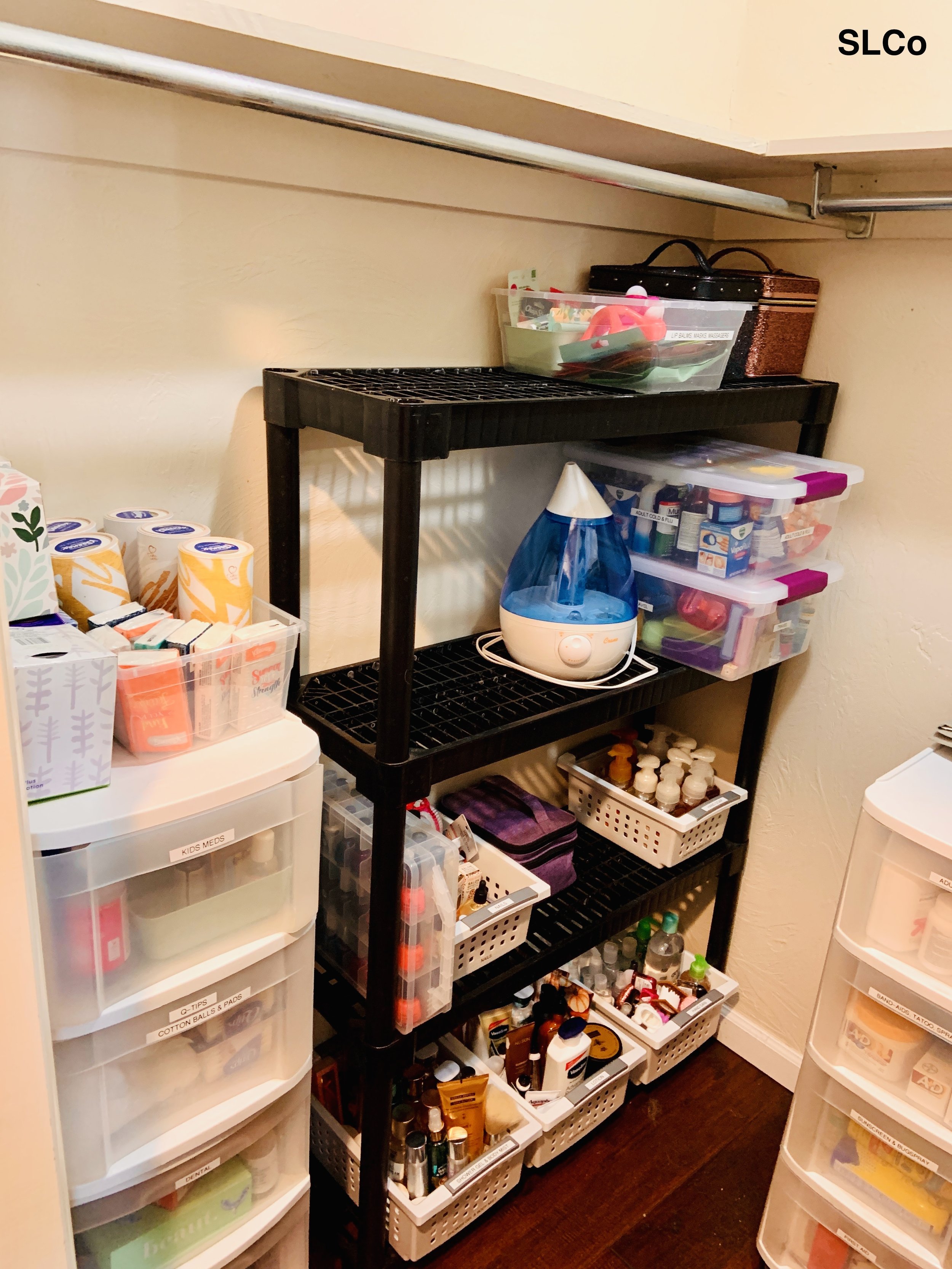 After photo of Arvada storage closet shelves ogranized with containers with like items together and extra space on the top.