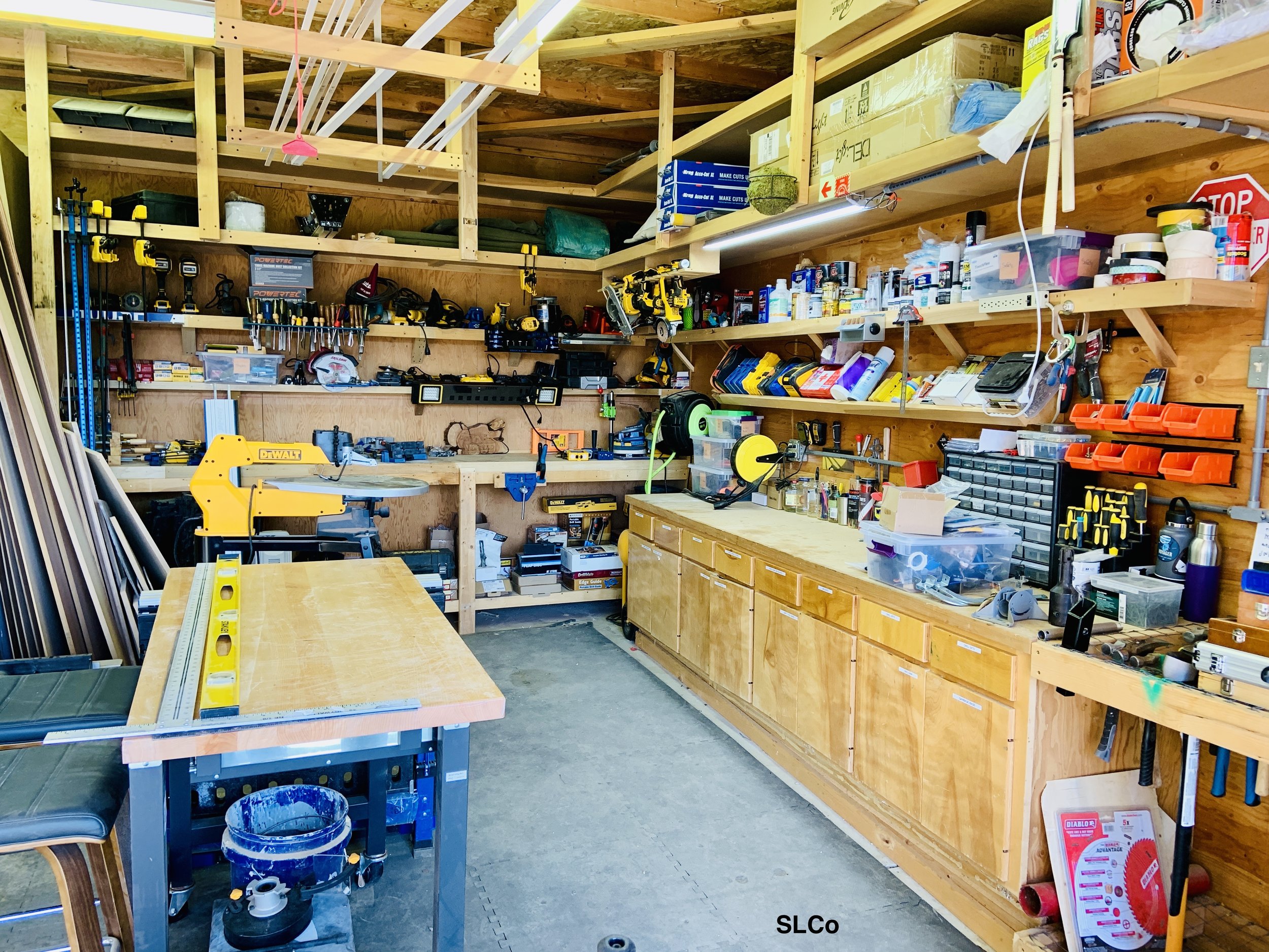 Workshop with tools in homes on walls and shelves and counters clear
