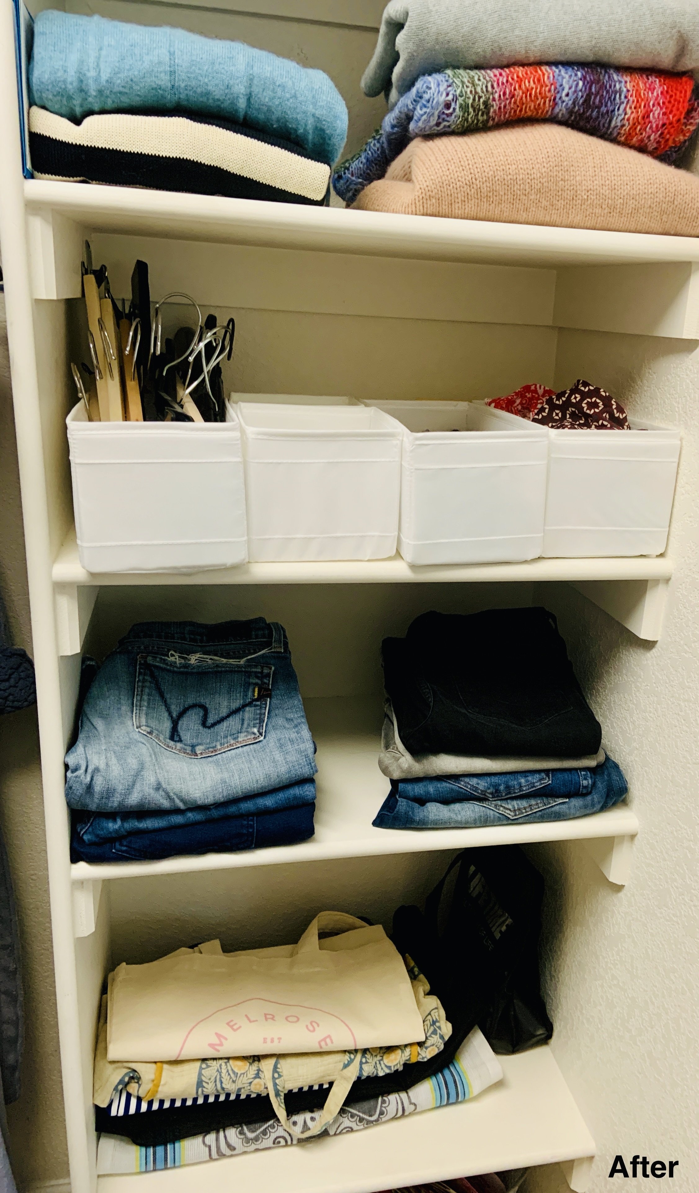 After photo of four white thin rows of wooden shelves with pants and shirts folded neatly and some containers for miscellaneous items.