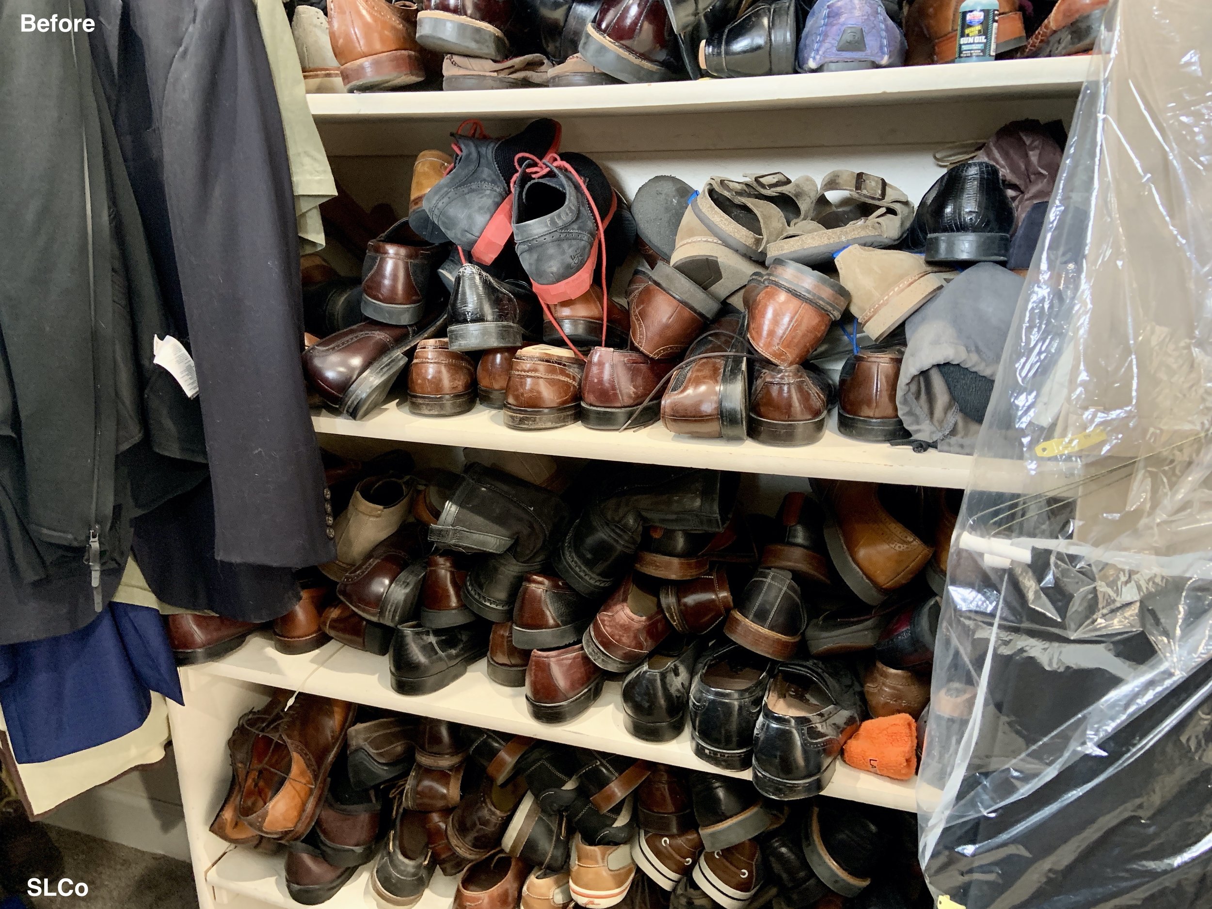 Close up image of shelves with stacks of leather shoes stacked on top of each other.