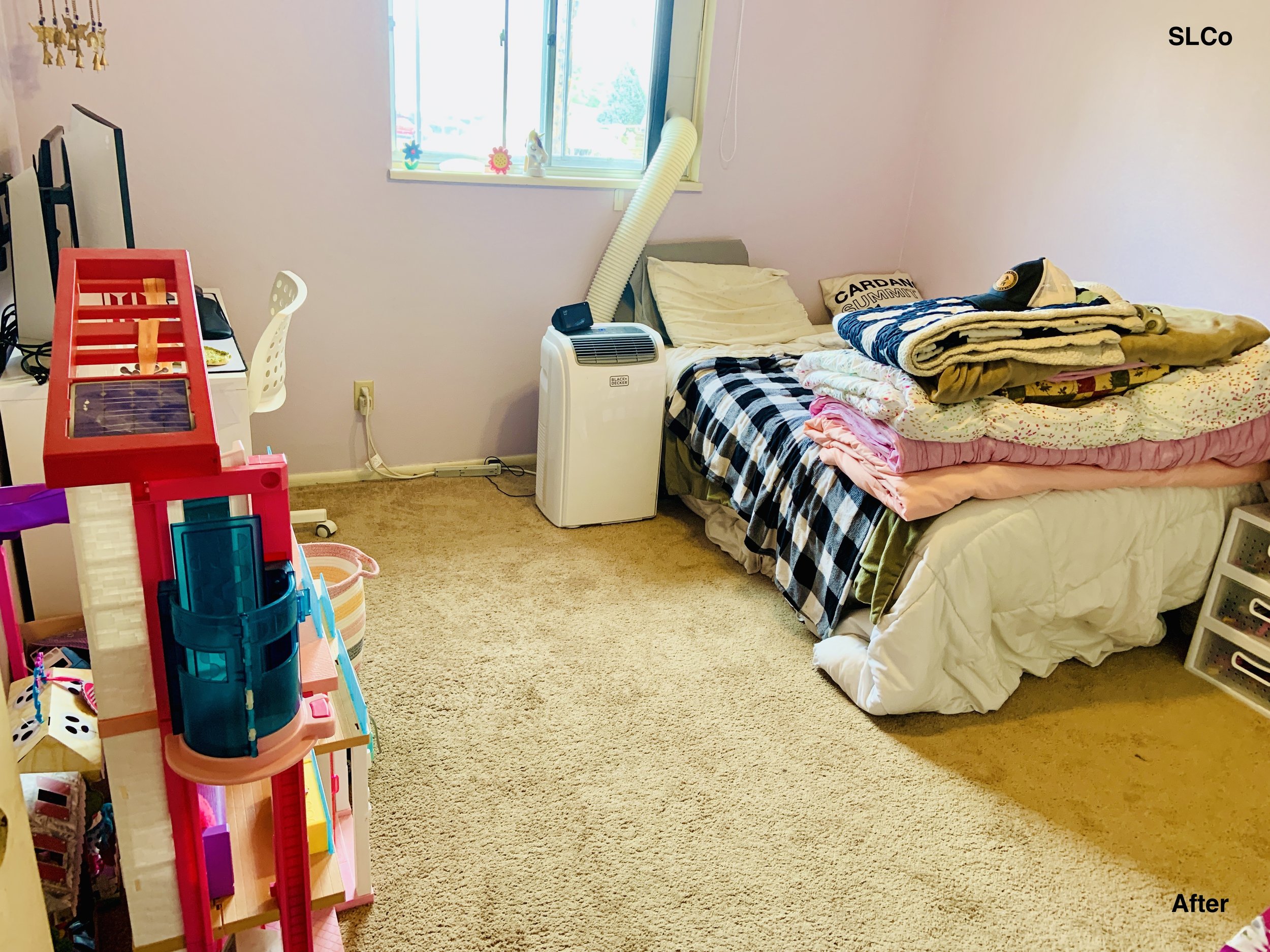 Bedroom with bed made, and floor clear