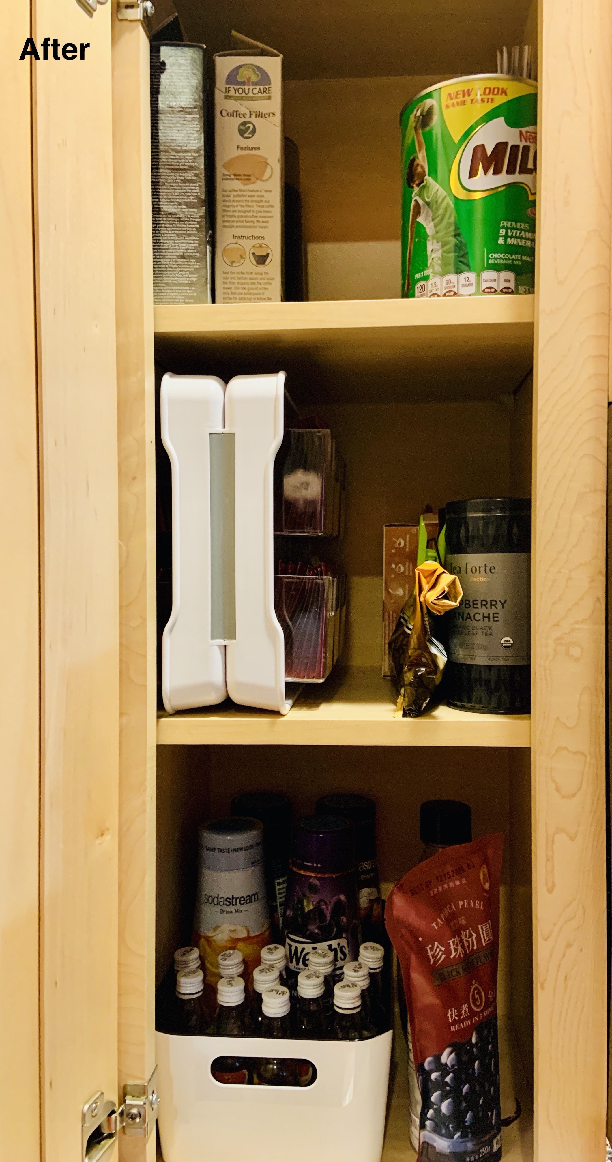 After photo of kitchen cabinet with teas and small containers organized into containers.