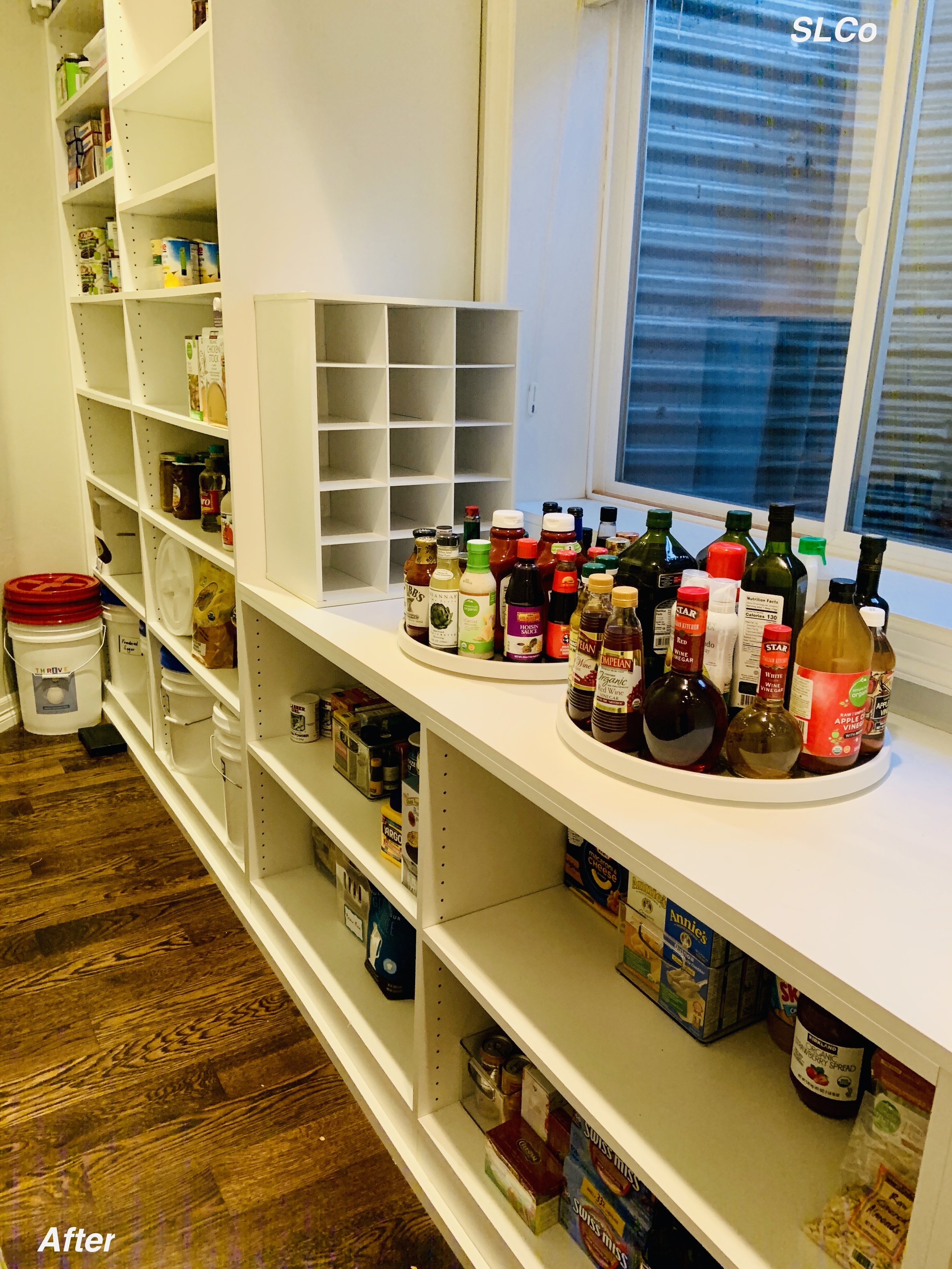 Large ktichen pantry, floor clear, and items organized on shelves.