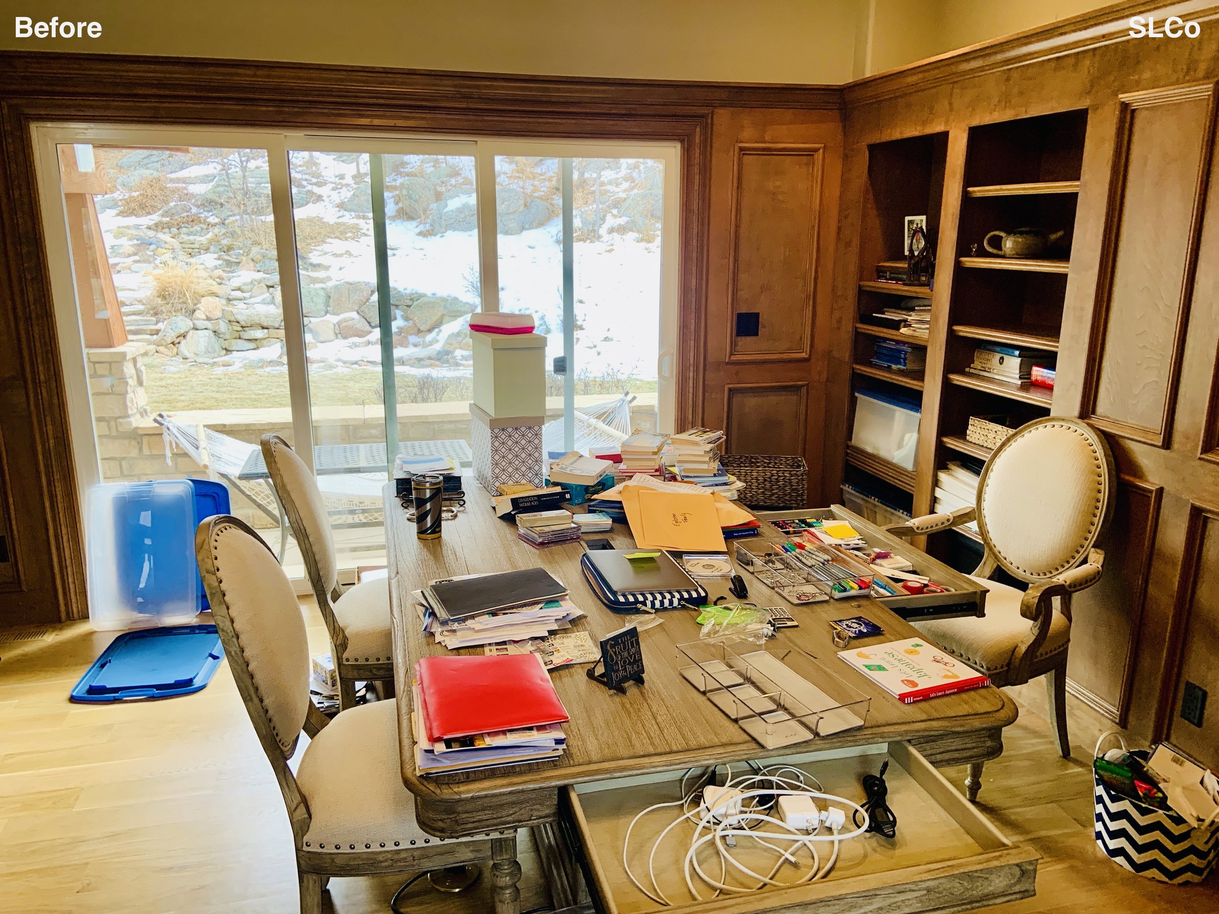 Before photo of home office with desk filled with items - more close up image.