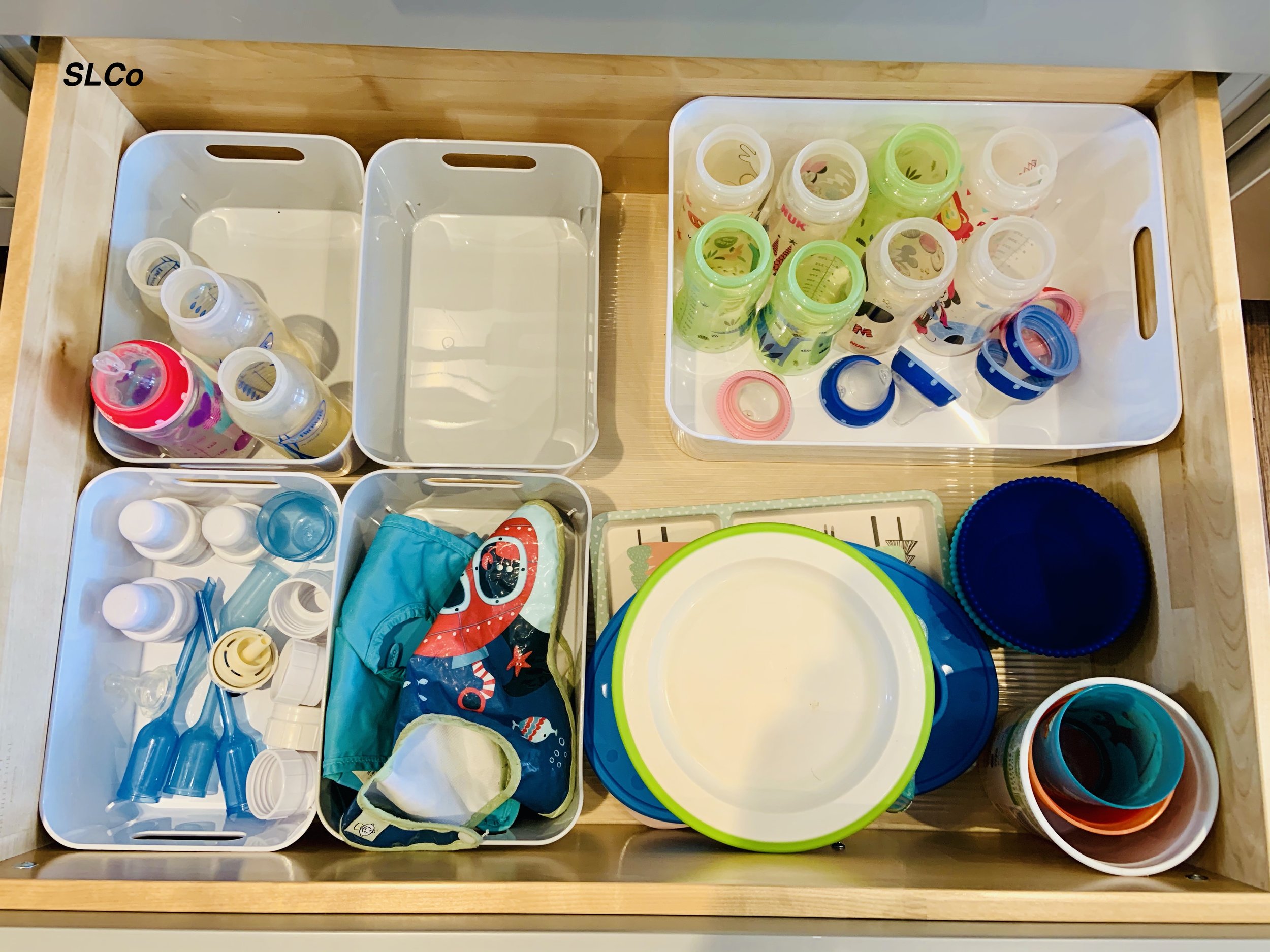 Kitchen drawer with 5 white bins neatly organized