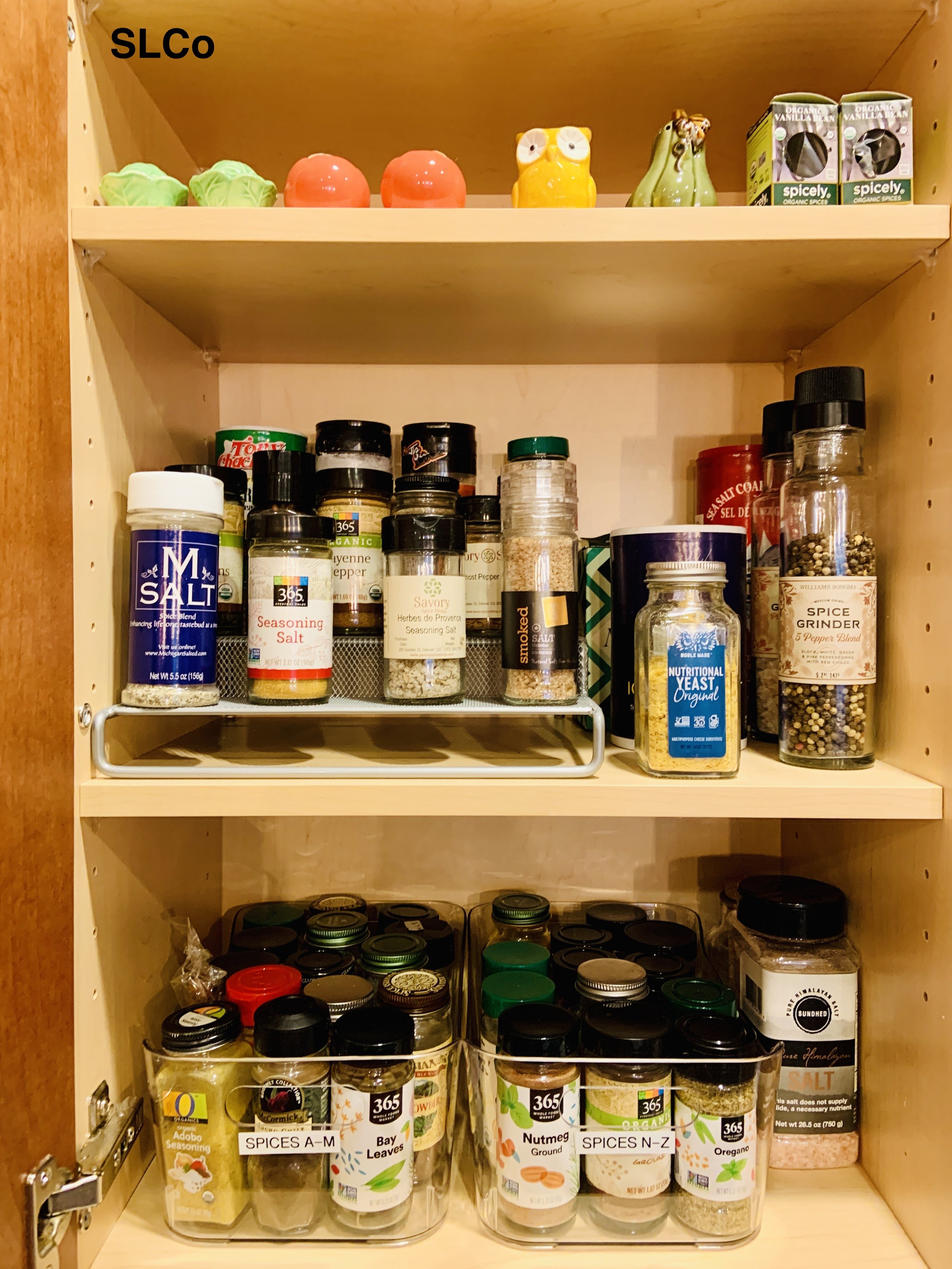 After photo of thin 3 shelf pantry cabinet with spices in bins